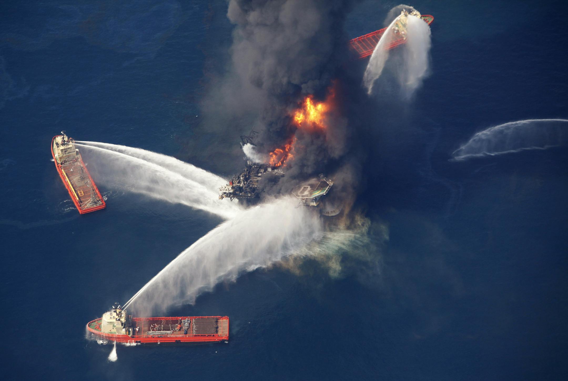 FILE - In this April 21, 2010, file photo, the Deepwater Horizon oil rig burns in the Gulf of Mexico following an explosion that killed 11 workers and caused the worst offshore oil spill in the nation's history. A federal judge in New Orleans granted final approval on Monday, April 4, 2016, to an estimated $20 billion settlement, resolving years of litigation over the spill. (AP Photo/Gerald Herbert, File)
