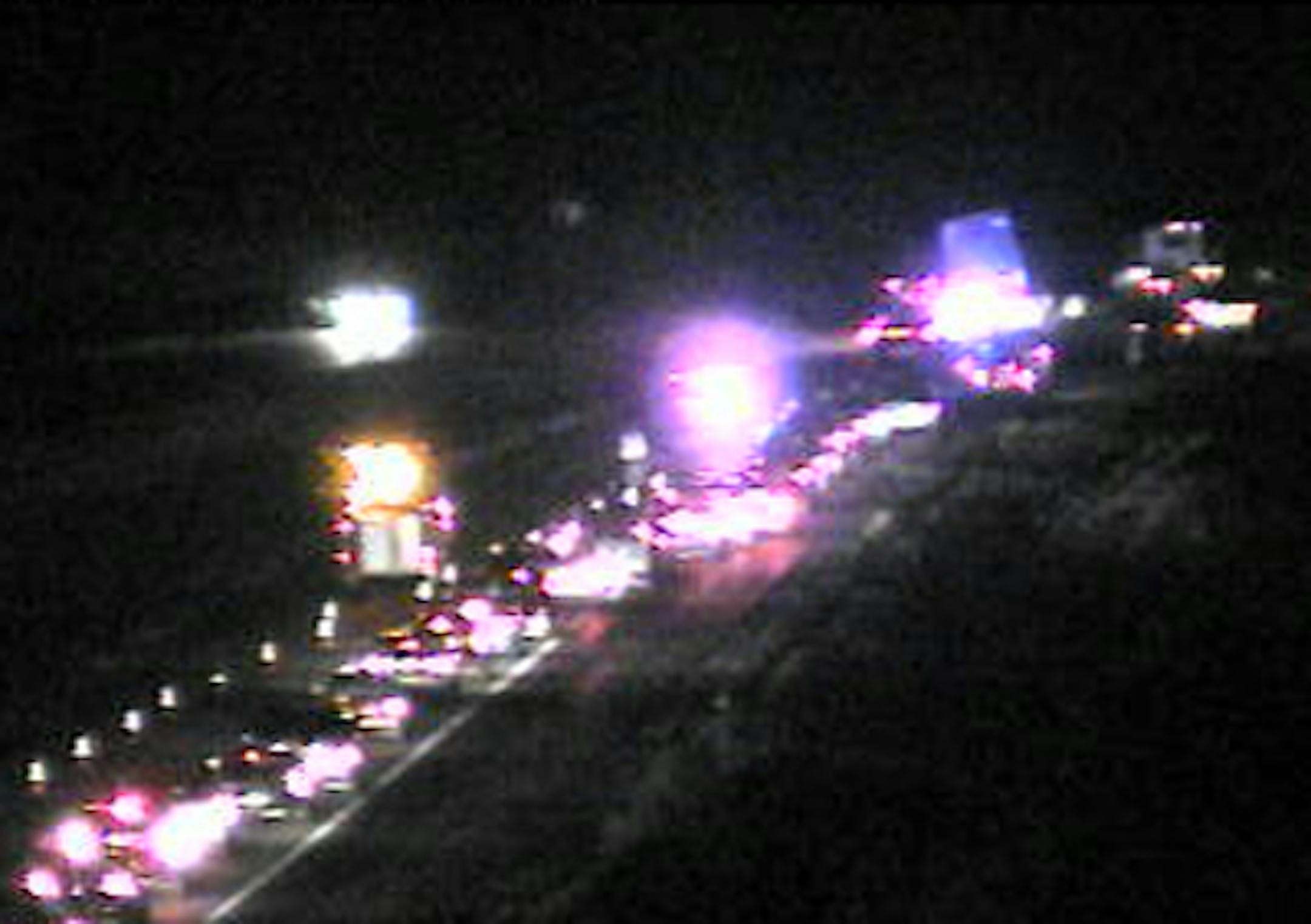 The scene on Interstate 35 south of Wyoming on Friday night after a semitrailer truck hit some furniture and ended up spilling milk.