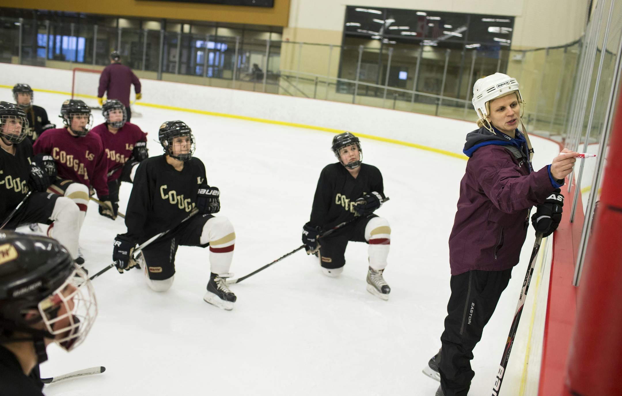 Lakeville South head coach Natalie Darwitz, right, during practice on Monday, January 11, 2015, in Lakeville, Minn. ] RENEE JONES SCHNEIDER • renee.jones@yahoo.com