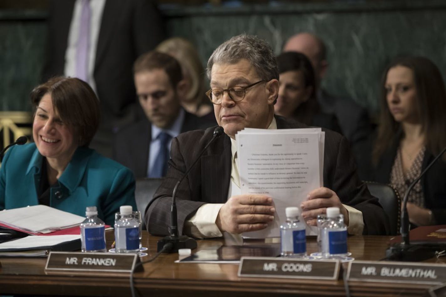 Senate Judiciary Committee Sen. Al Franken, D-Minn., accompanied by Sen. Amy Klobuchar, D-Minn., concludes his remarks on Capitol Hill in Washington, Wednesday, Feb. 1, 2017, before the committee voted to approve the nomination of Attorney General-designate Sen. Jeff Sessions, R-Ala., following angry exchanges between Republicans and Democrats.