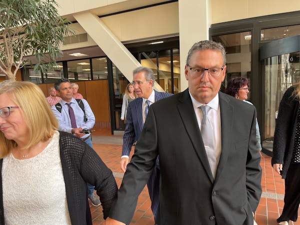 Jerry Westrom left court after closing arguments Thursday morning with his wife, Elizabeth Ann, and accompanied by their attorney Steve Meshbesher.