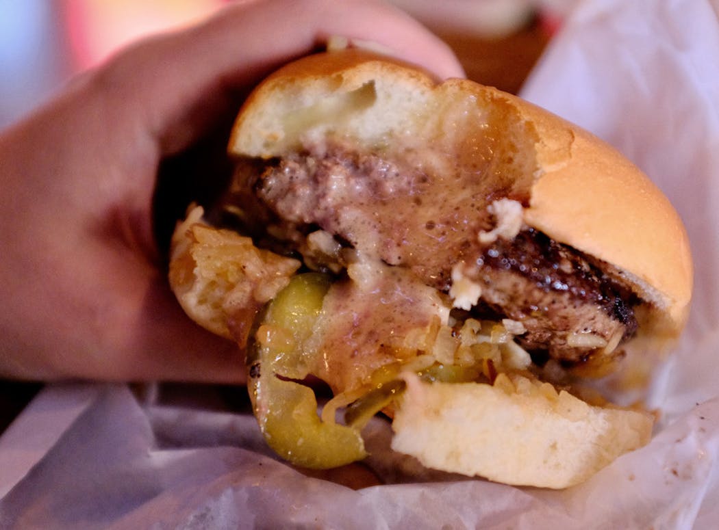 Molten cheese and fat oozes from a Jucy Lucy at Matt’s Bar.