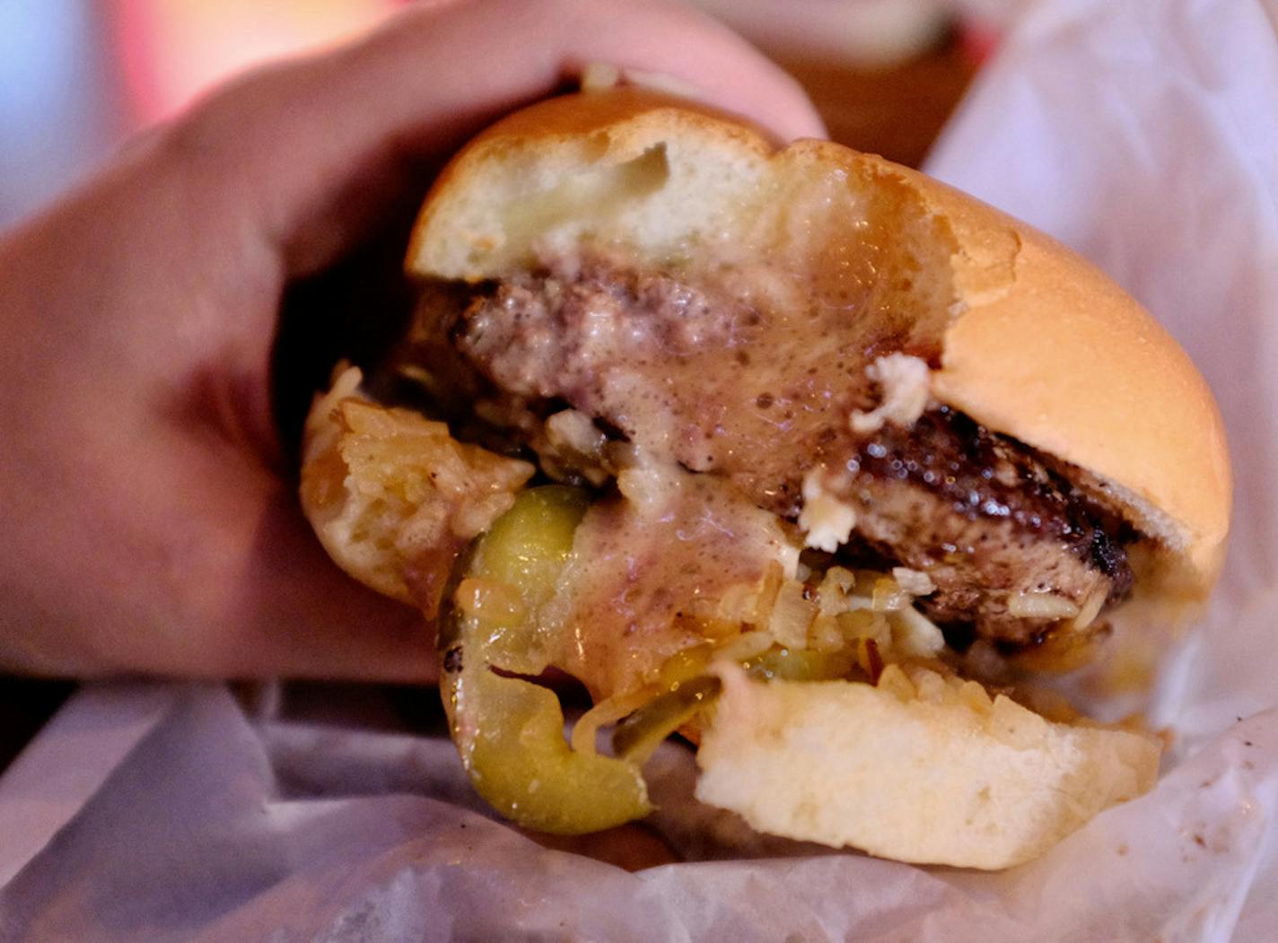 Molten cheese oozes from a Jucy Lucy at Matt's Bar. (This does not constitute an endorsement.)