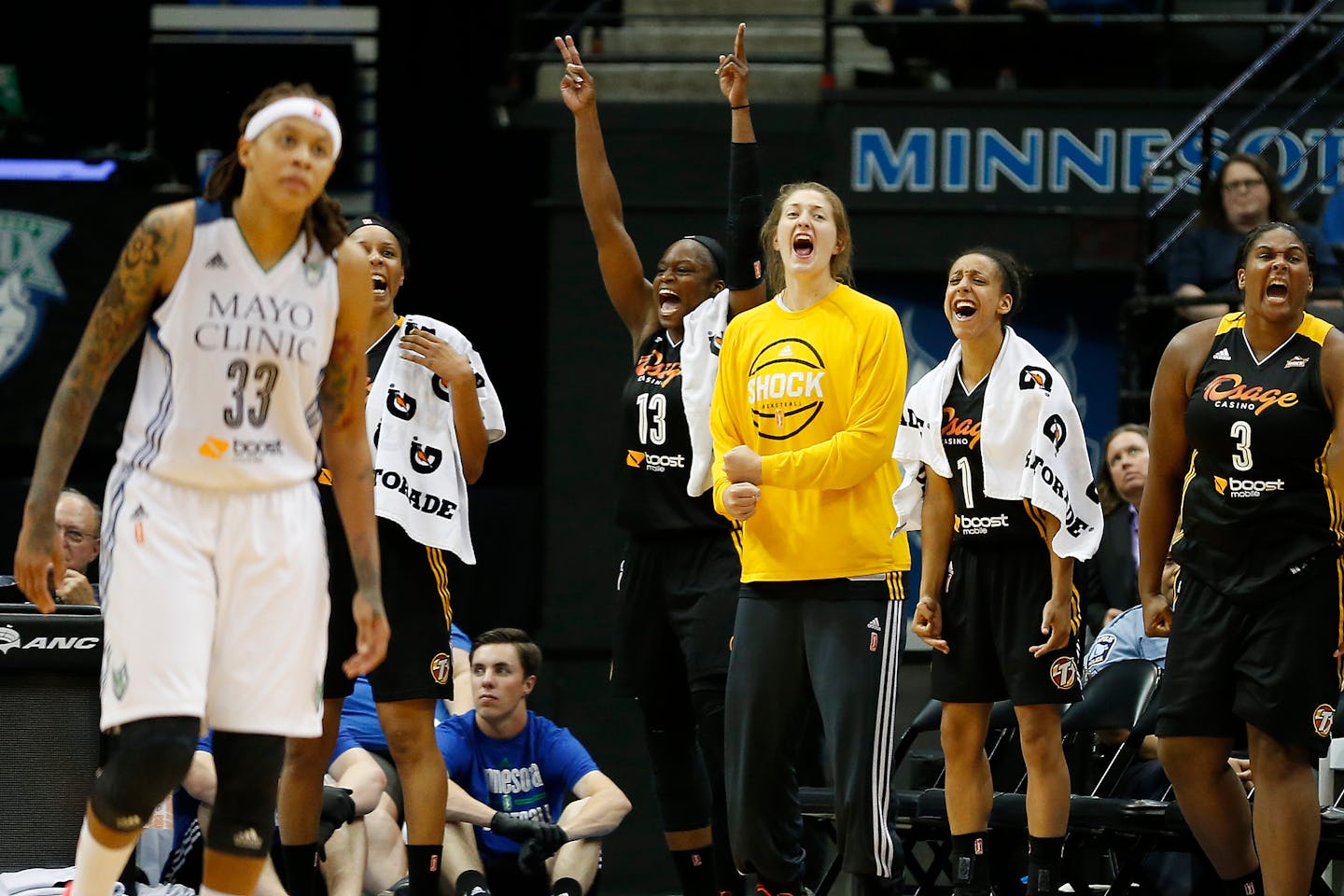 Players on the Tulsa Shock bench celebrated while their team extended its lead against Seimone Augustus, left, and the Lynx during the second half of Sunday's game at Target Center. Tulsa won 86-78 in a matchup of Western Conference teams that entered the game with 5-1 records.