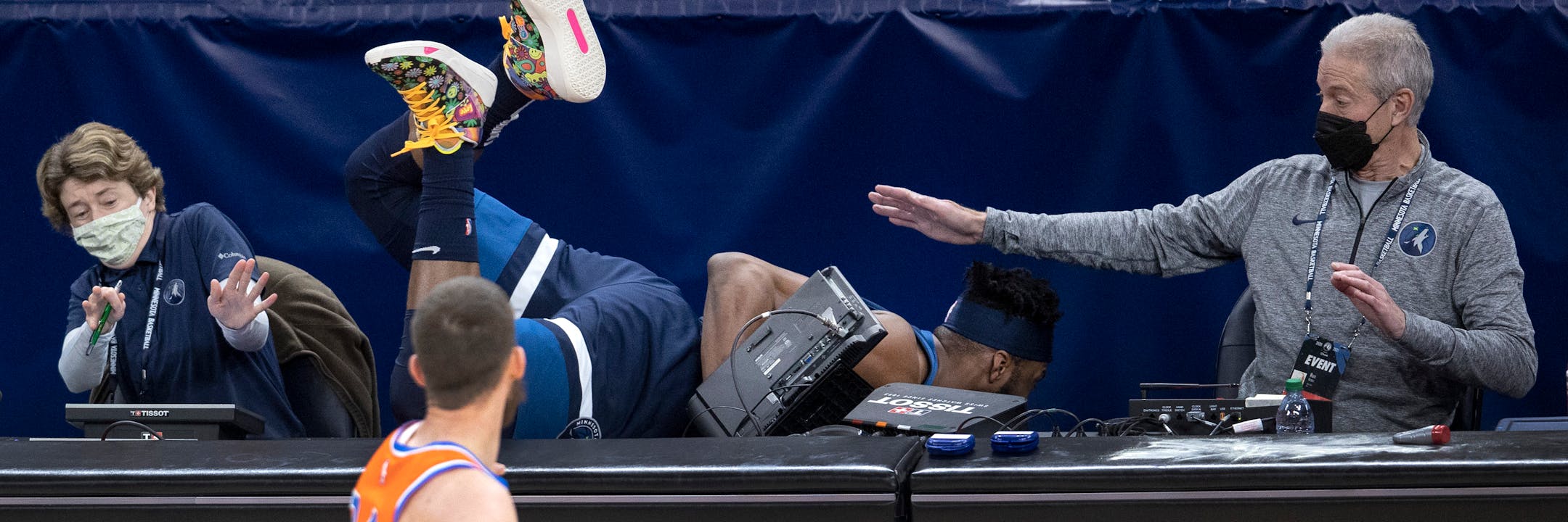 Josh Okogie (20) of the Minnesota Timberwolves fell into the scorers table in the second quarter.
