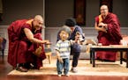 Tsering Dorjee Bawa, puppeteer Masanari Kawahara and Eric &#xec;Pogi&#xee; Sumangil in "The Oldest Boy" at the Jungle Theater.
PHOTO CREDIT: Dan Norma