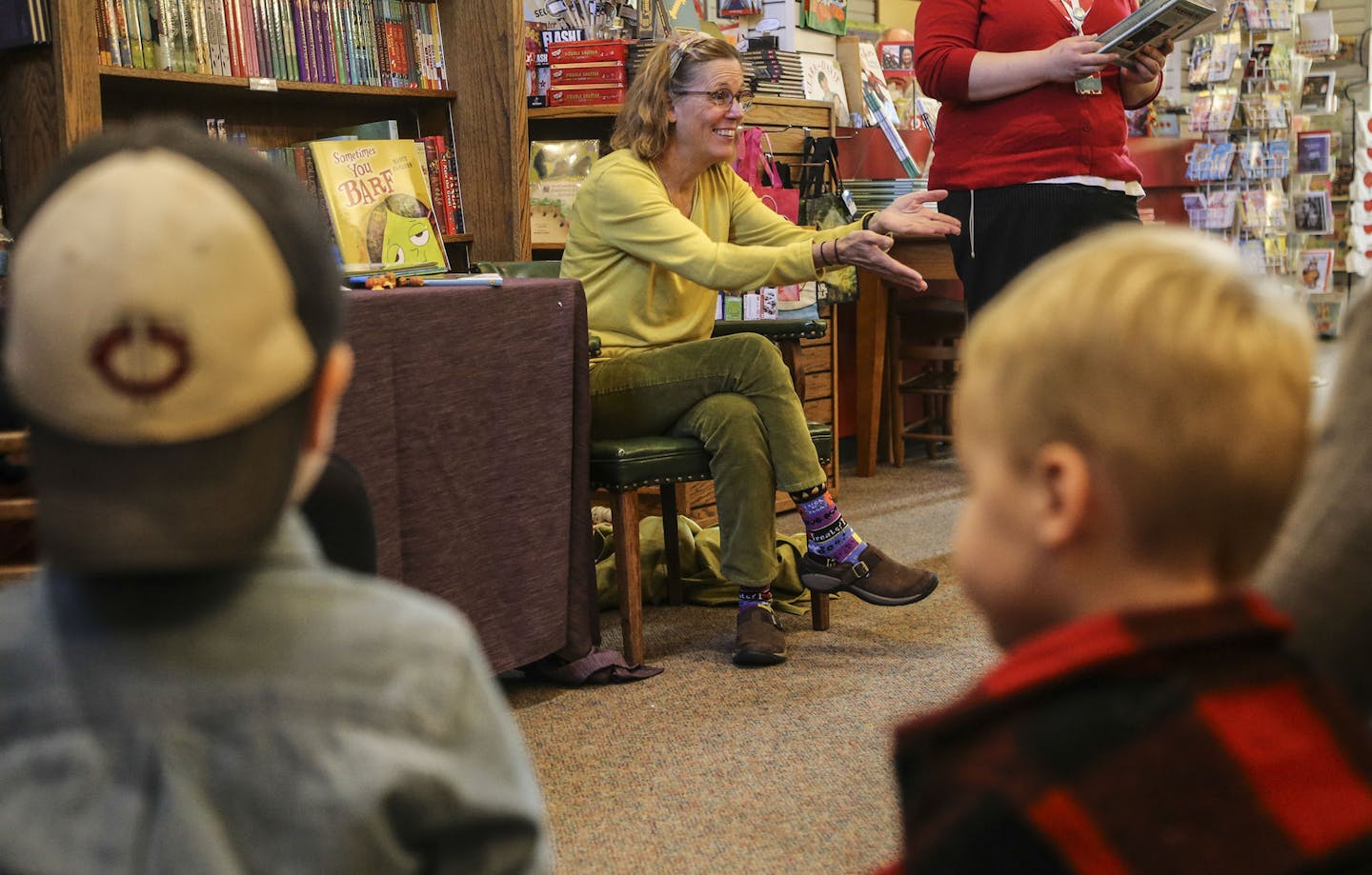 Writer and illustrator Nancy Carlson read from her new children's book (her 66th), called "Sometimes You Barf, " at Red Balloon Books Saturday, Oct. 25, 2014, in St. Paul, MN. Here, she put her arms out for a crying child.](DAVID JOLES/STARTRIBUNE)djoles@startribune.com With characteristic humor, Nancy Carlson writes -- and draws -- about coping with the humiliation of an out-of-control mess. Carlson will be reading from her new children's book (her 66th), called "Sometimes You Barf." In additio