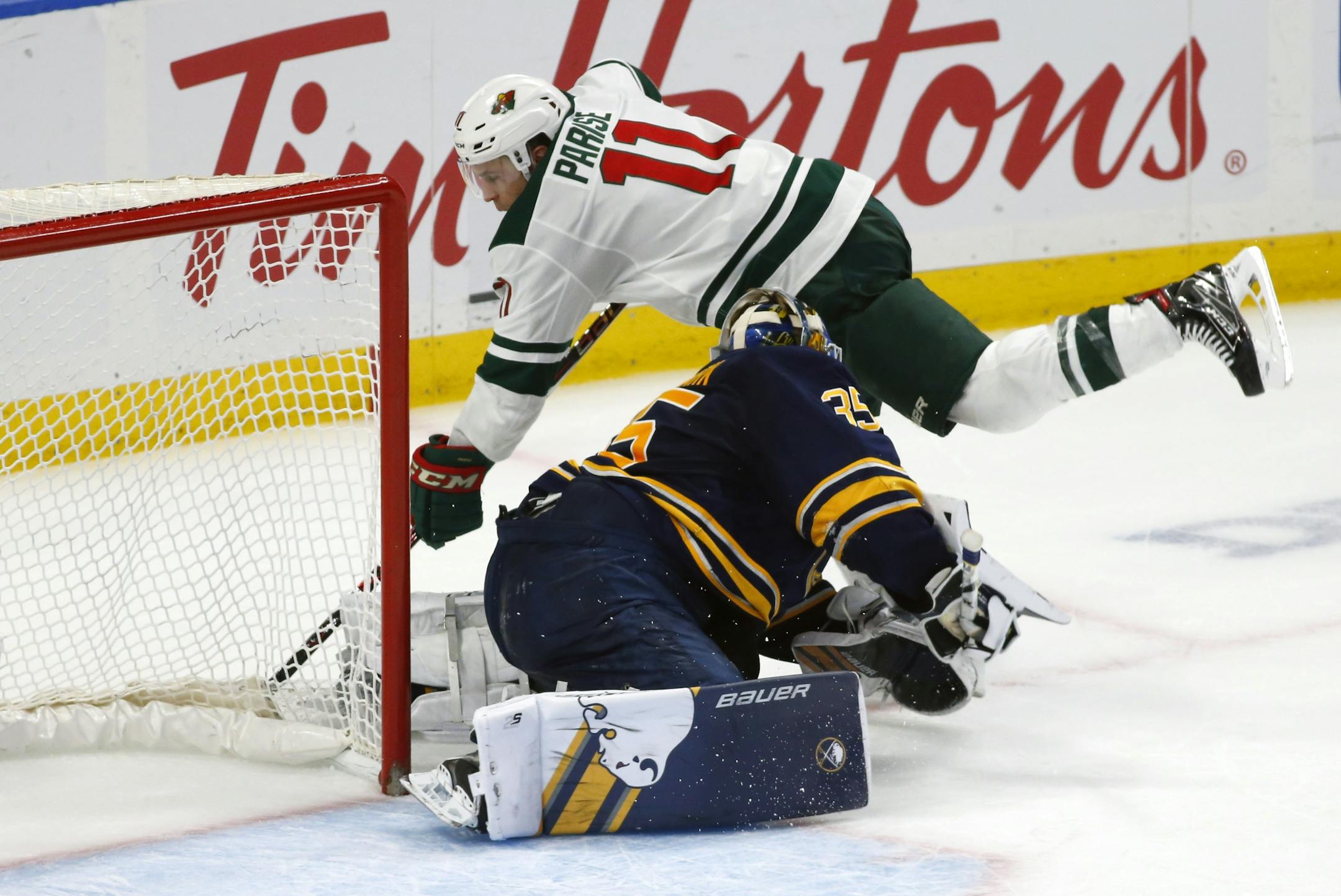 Buffalo Sabres goalie Linus Ullmark (35) stops Minnesota Wild forward Zach Parise (11) during the shootout following the third period of an NHL hockey game, Tuesday, Feb. 5, 2019, in Buffalo N.Y.
