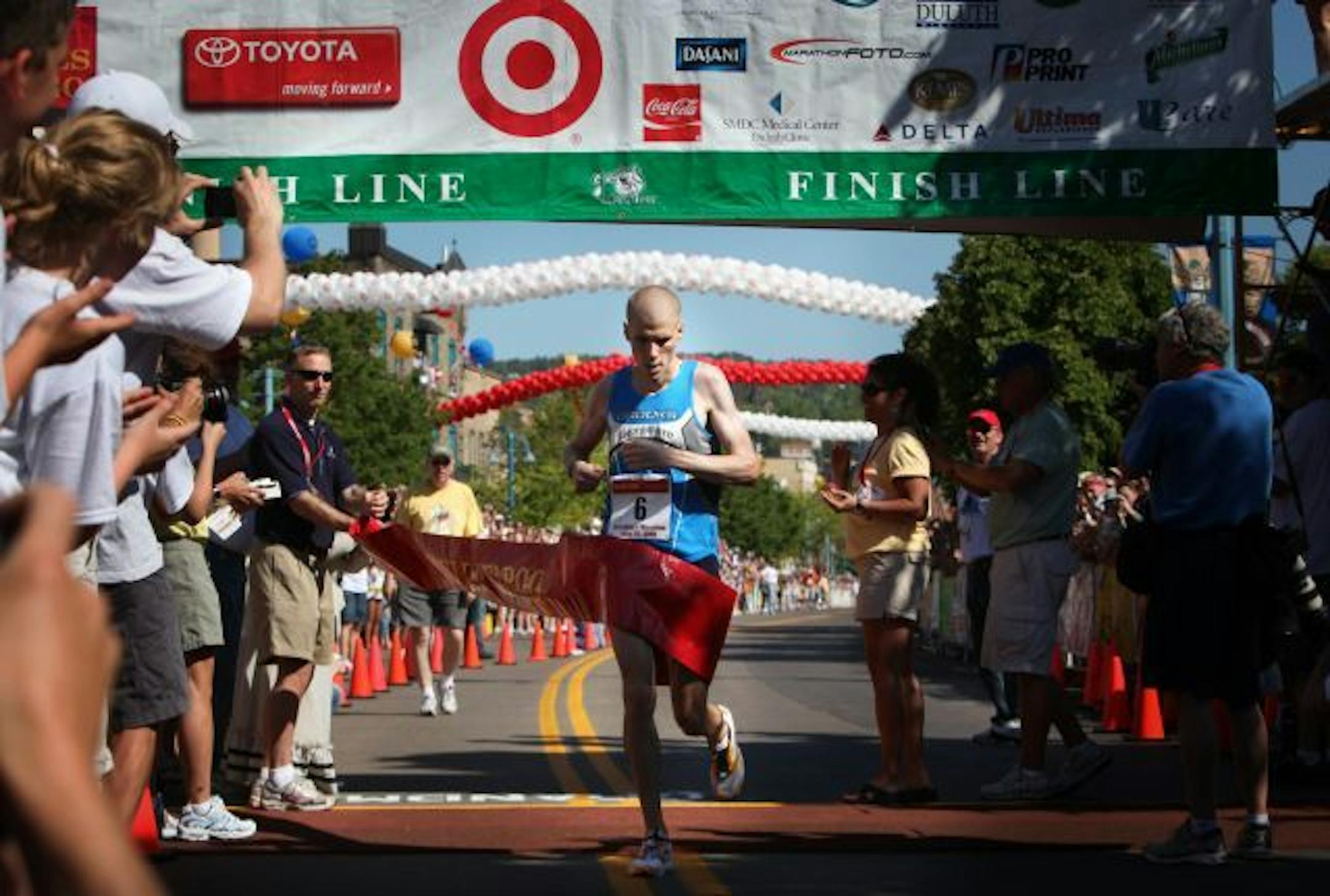Christopher Raabe crossed the finish line at Grandma's Marathon with a winning time of 2:15:13 Saturday in Duluth.