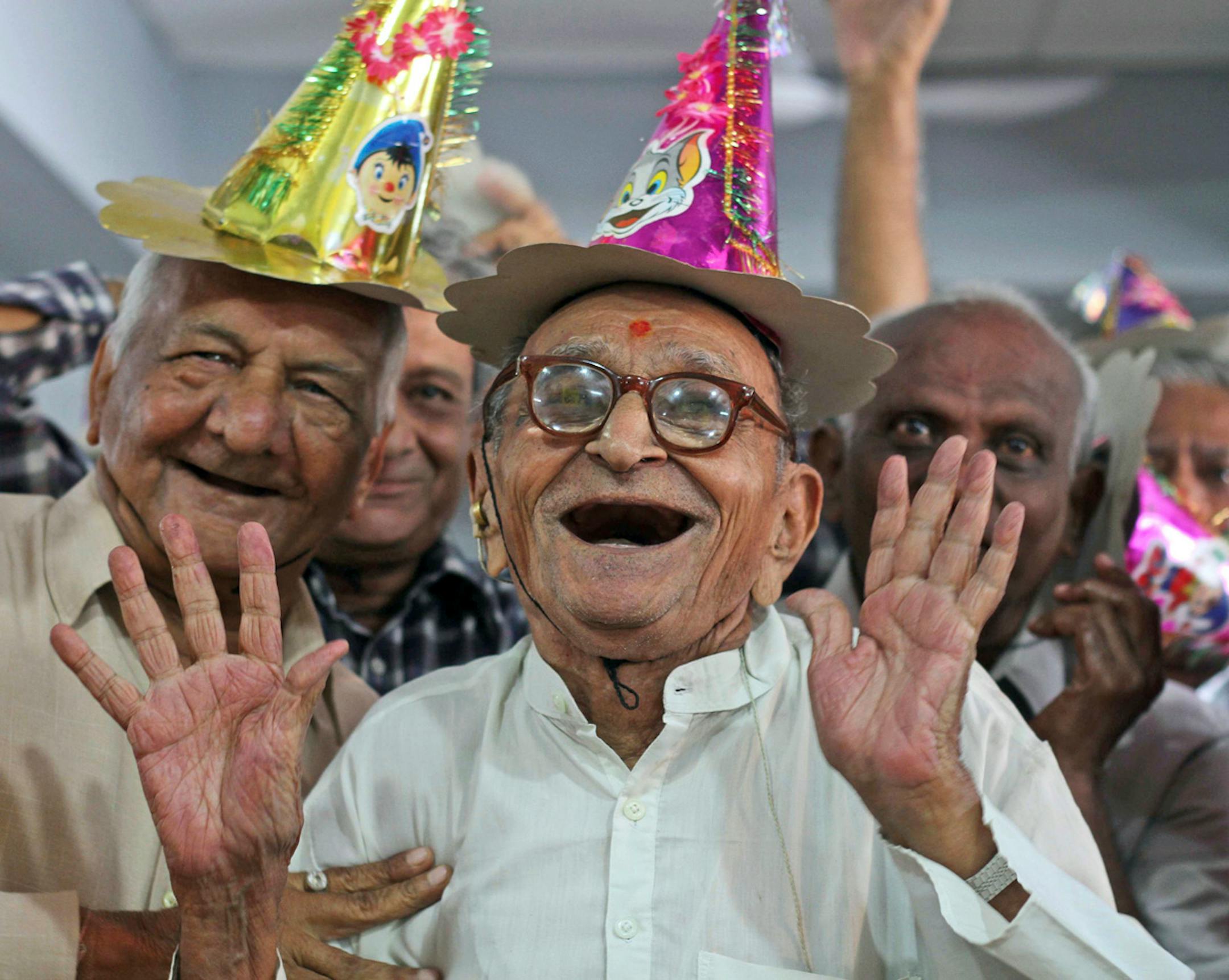 Elderly Indians participate in celebrations to mark International Day of Older Persons at an old age home in Ahmadabad, India, Tuesday, Oct. 1, 2013. Much of the world is not prepared to support the ballooning population of elderly people, including many of the fastest-aging countries, according to a global study scheduled to be released Tuesday, Oct. 1, by the United Nations and an elder rights group. (AP Photo/Ajit Solanki)