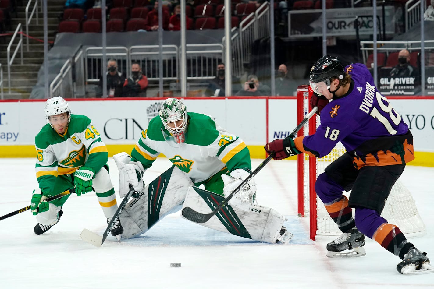 Coyotes center Christian Dvorak worked around the Wild net in the second period