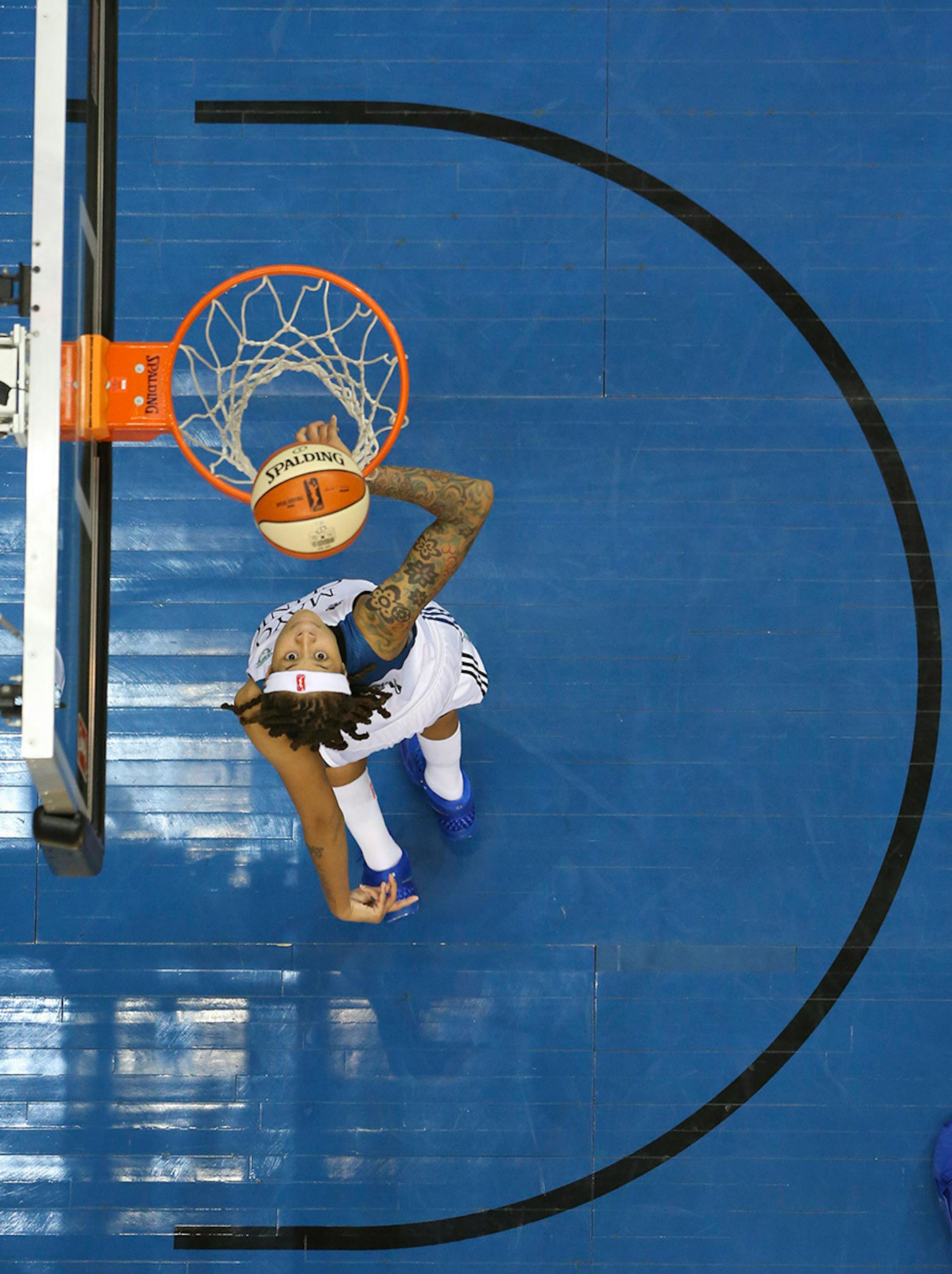 Lynx guard Seimone Augustus (33) with a first half layup Thursday night at Target Center.