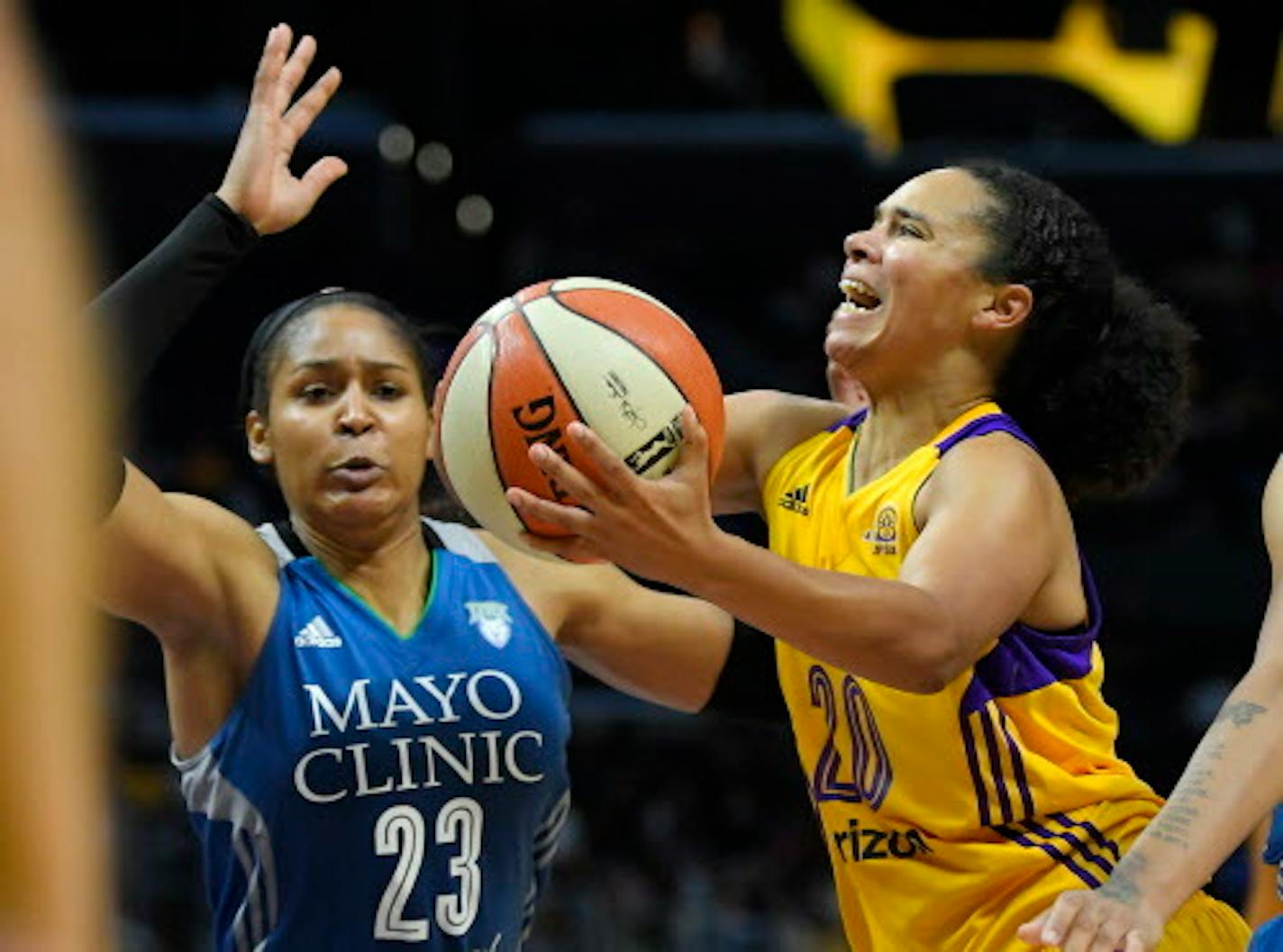 FILE - This Oct. 16, 2016, file photo shows Los Angeles Sparks guard Kristi Toliver, right, shooting as Minnesota Lynx forward Maya Moore defends during the second half in Game 4 of the WNBA Finals in Los Angeles.  As the WNBA enters the final week of the regular season, there are a few playoff spots still up for grabs and the postseason seeding is still jumbled. Los Angeles and Minnesota have clinched the top two seeds. The Sparks though only sit a half-game behind the Lynx for home court advantage throughout the postseason and have the tiebreaker. The Sparks also were a unanimous choice atop The Associated Press WNBA power poll on Tuesday, Aug. 29, 2017.  (AP Photo/Mark J. Terrill, File)