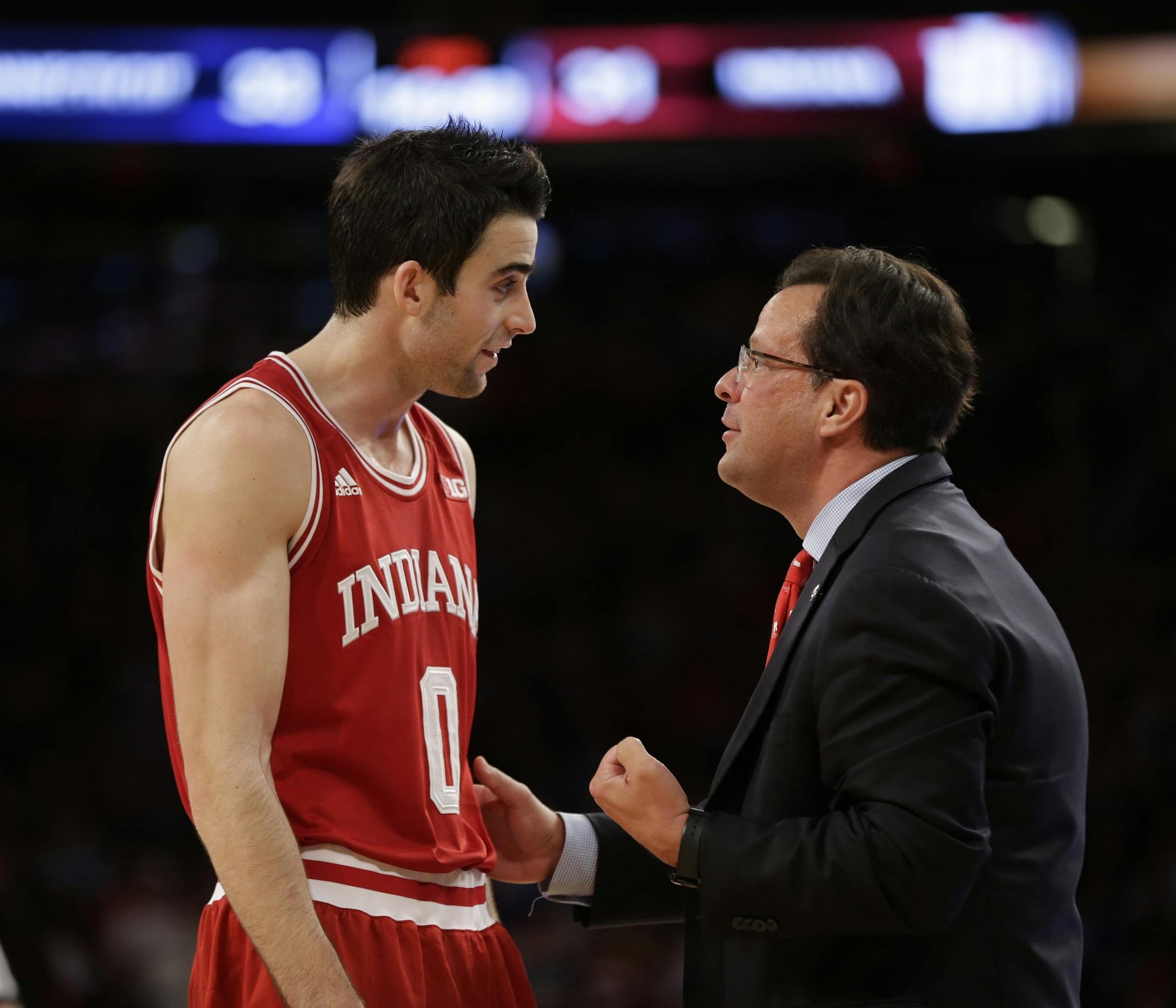 Indiana's Will Sheehey, left, talks with head coach Tom Crean during the second half of an NCAA college basketball game against Connecticut, Friday, Nov. 22, 2013, in New York. Connecticut won 59-58. (AP Photo/Seth Wenig)