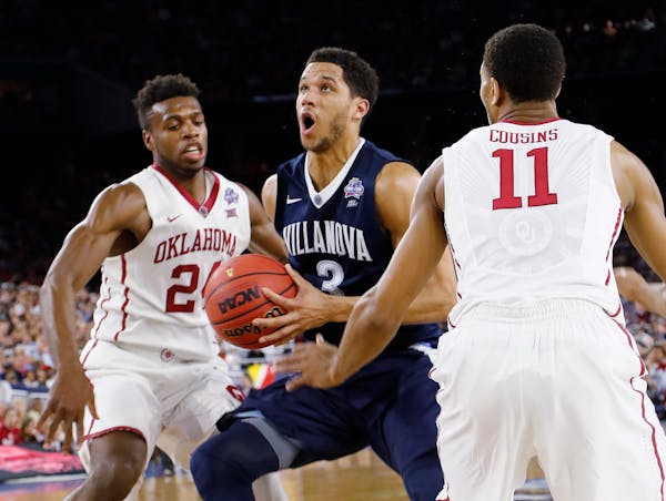 Villanova guard Josh Hart (3) moves between Oklahoma's Cousins (11) and Buddy Hield (24) during the second half of the NCAA Final Four tournament coll