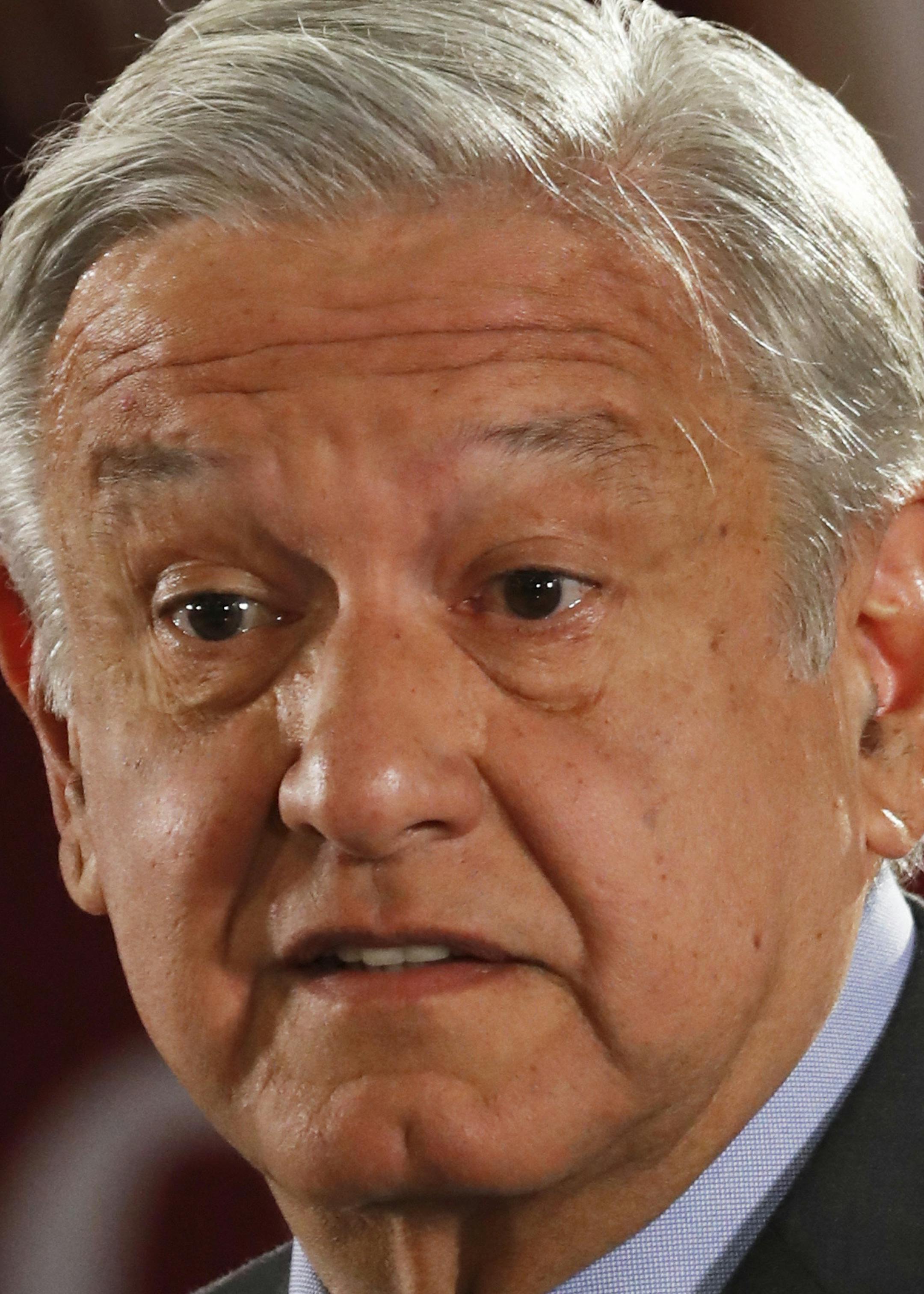 In this March 8, 2019 photo, Mexican President Andres Manuel Lopez Obrador speaks to journalists at his daily 7 a.m. press conference at the National Palace in Mexico City. Lopez Obrador's first 100 days in office have combined a compulsive shedding of presidential trappings with a dizzying array of policy initiatives, and a series of missteps haven't even dented his soaring approval ratings.(AP Photo/Marco Ugarte) ORG XMIT: MXMU208