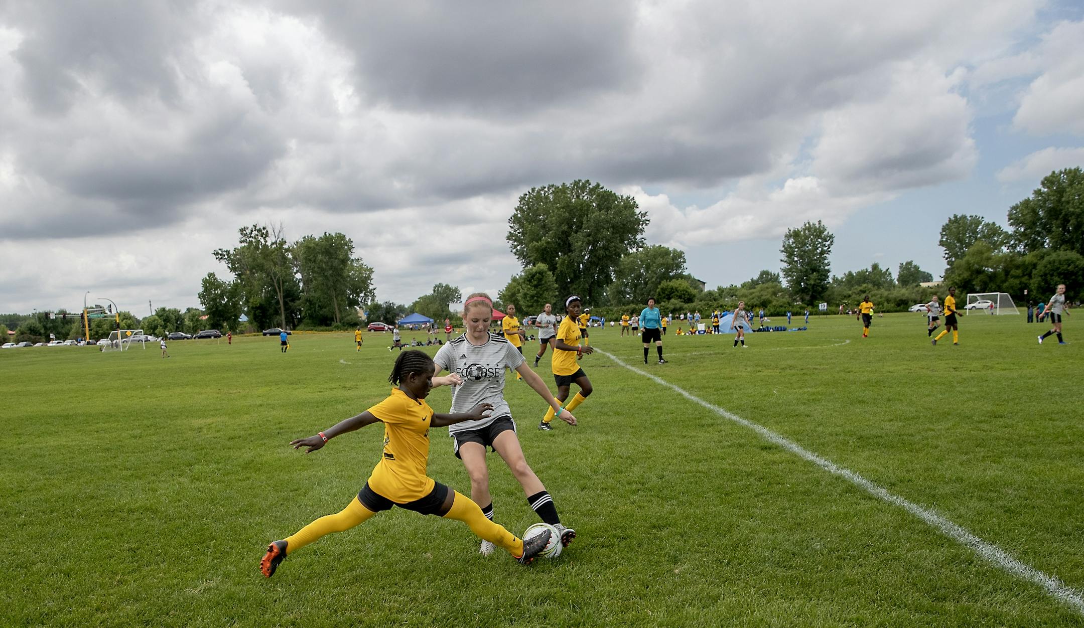 Monrovia Football Academy's Jemama Vah and a defender from the Eclipse Select MN Regional battled for the ball during the USA Cup tournament, Tuesday, July 16, 2019 at the National Sports Center in Blaine, MN. The youth soccer team from Liberia traveled to Minnesota for its first trip to the States, to play in the mega-tourney and were supported by the local Liberian community. Monrovia defeated Minnesota 9-1.