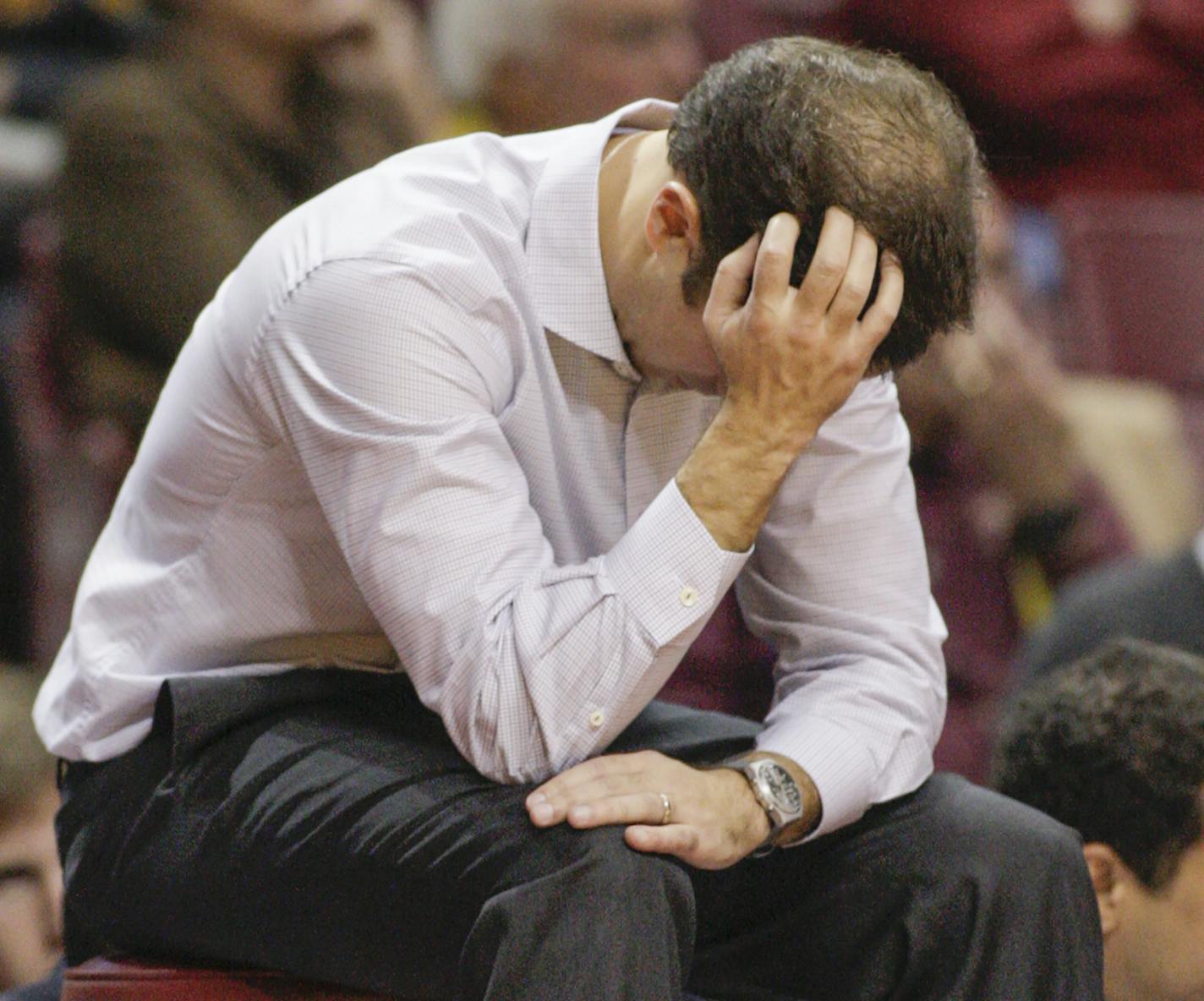 Minnesota head coach Richard Pitino holds his head near the end Minnesota's 85-81 double-overtime loss to South Dakota during an NCAA college basketball game, Saturday, Dec. 5, 2015, in Minneapolis. (AP Photo/Paul Battaglia) ORG XMIT: MIN2016011518081487