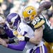 Vikings quarterback Sam Bradford (8) fumbled the ball as he was sacked by Clay Matthews (52) in the second quarter.