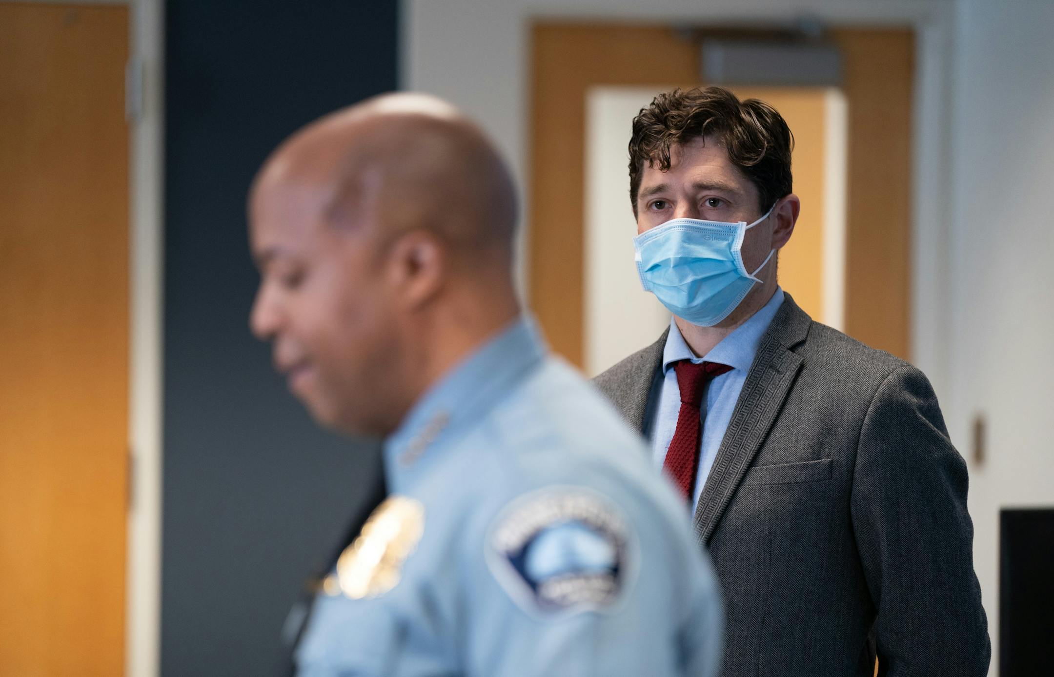 Minneapolis Mayor Jacob Frey watches as Police Chief Medaria Arradondo announces he will retire at the end of this term, Monday, Dec. 6, 2021 during a news conference in Minneapolis.