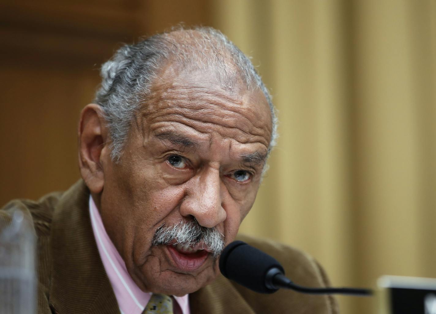 FILE- In this April 4, 2017, file photo, Rep. John Conyers, D-Mich., speaks during a hearing of the House Judiciary subcommittee on Capitol Hill in Washington. House Democratic Leader Nancy Pelosi is defending Conyers as an "icon" for women's rights and declining to say whether the longtime lawmaker should resign over allegations that he sexually harassed female staff members. (AP Photo/Alex Brandon, File)