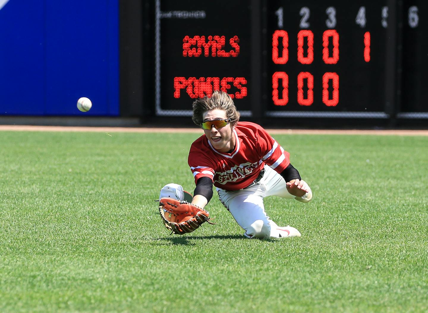 Stillwater's Kade Peloquin dove to catch a ball in the Class 4A, Section 4 championship game against Woodbury on June 4, 2019.