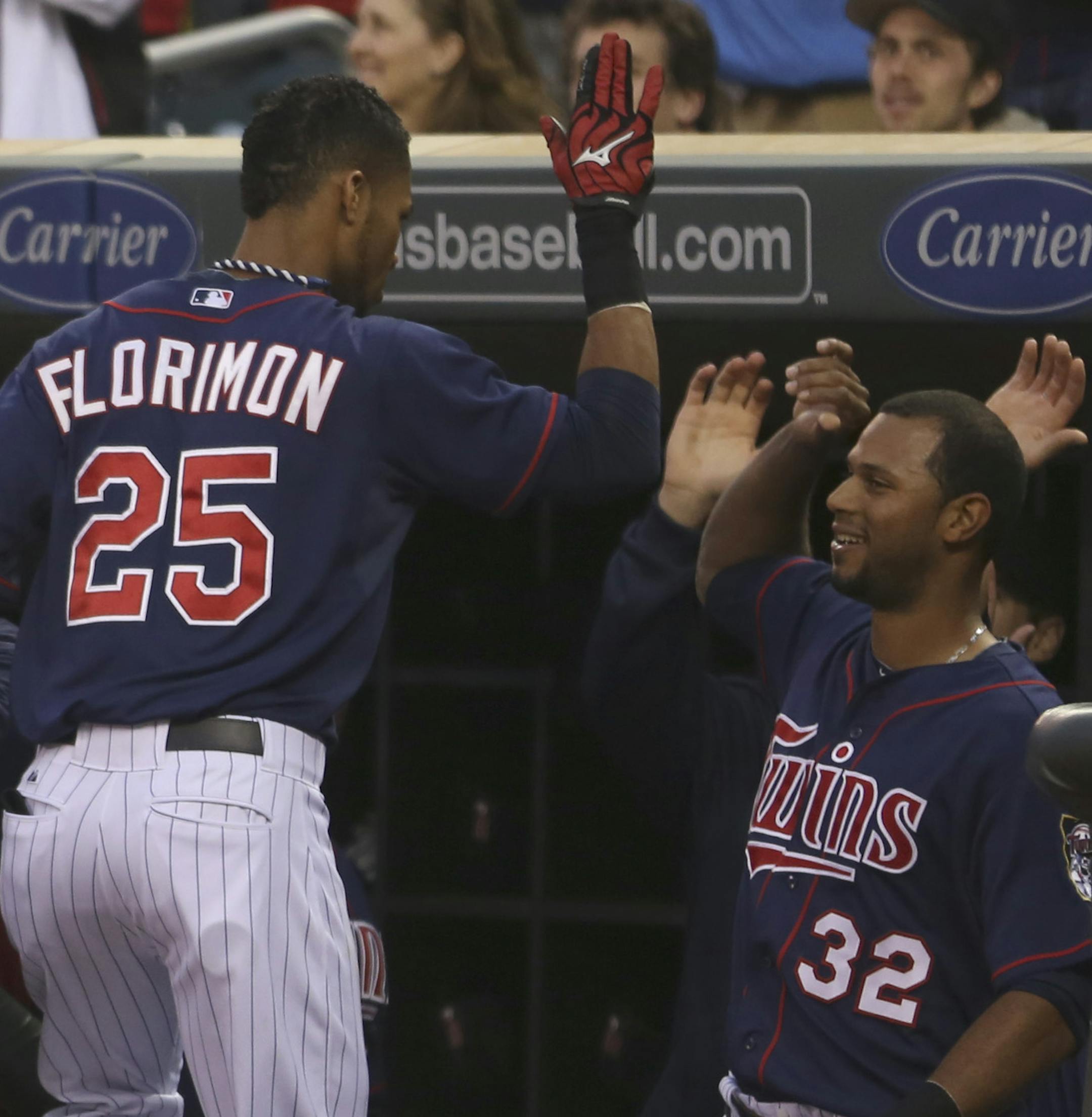 Twins Pedro Florimon celebrated with teammates after hitting a two-run homerun during the third inning at Target Field in Minneapolis, Min., Friday, May 17, 2013 ] (KYNDELL HARKNESS/STAR TRIBUNE) kyndell.harkness@startribune.com