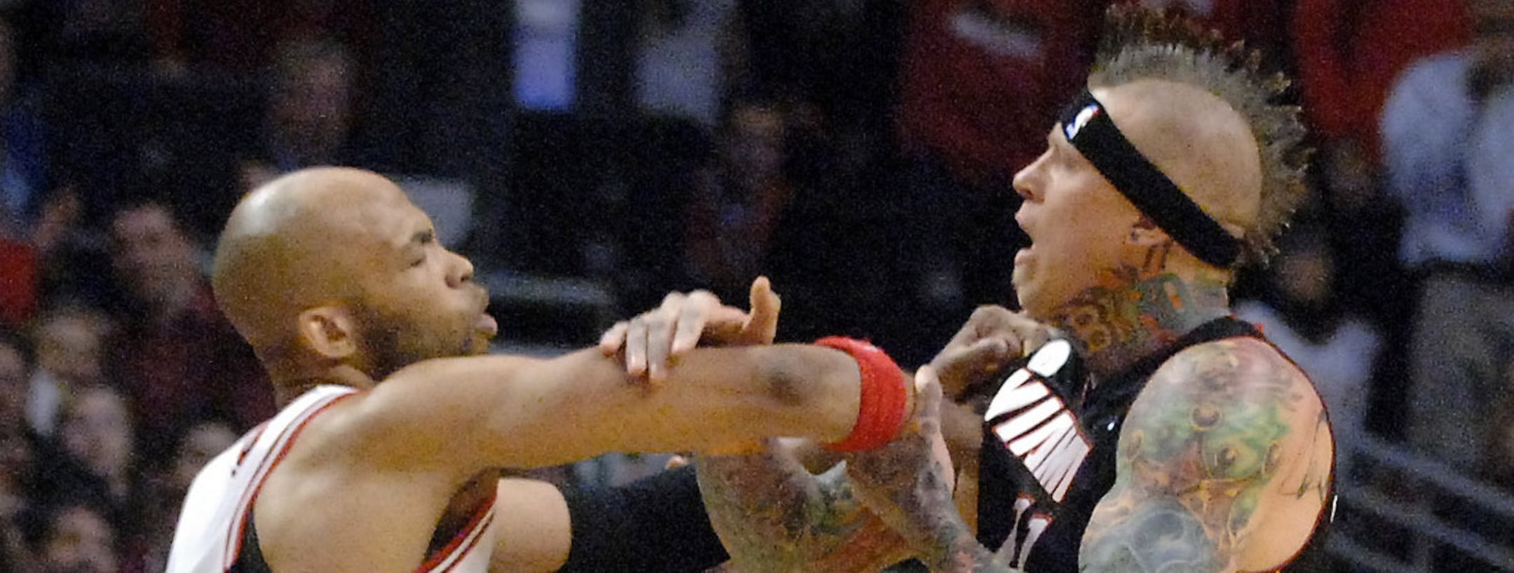 Chicago Bulls power forward Taj Gibson (22) and Miami Heat power forward Chris Andersen (11) get in a shoving match following Nazr Mohammed foul on LeBron James during Game 3 of an NBA basketball playoffs Eastern Conference semifinal on Friday, May 10, 2013, in Chicago. The Heat won 104-94. (AP Photo / Daily Herald, Rick West) MANDATORY CREDIT, MAGS OUT, TV OUT