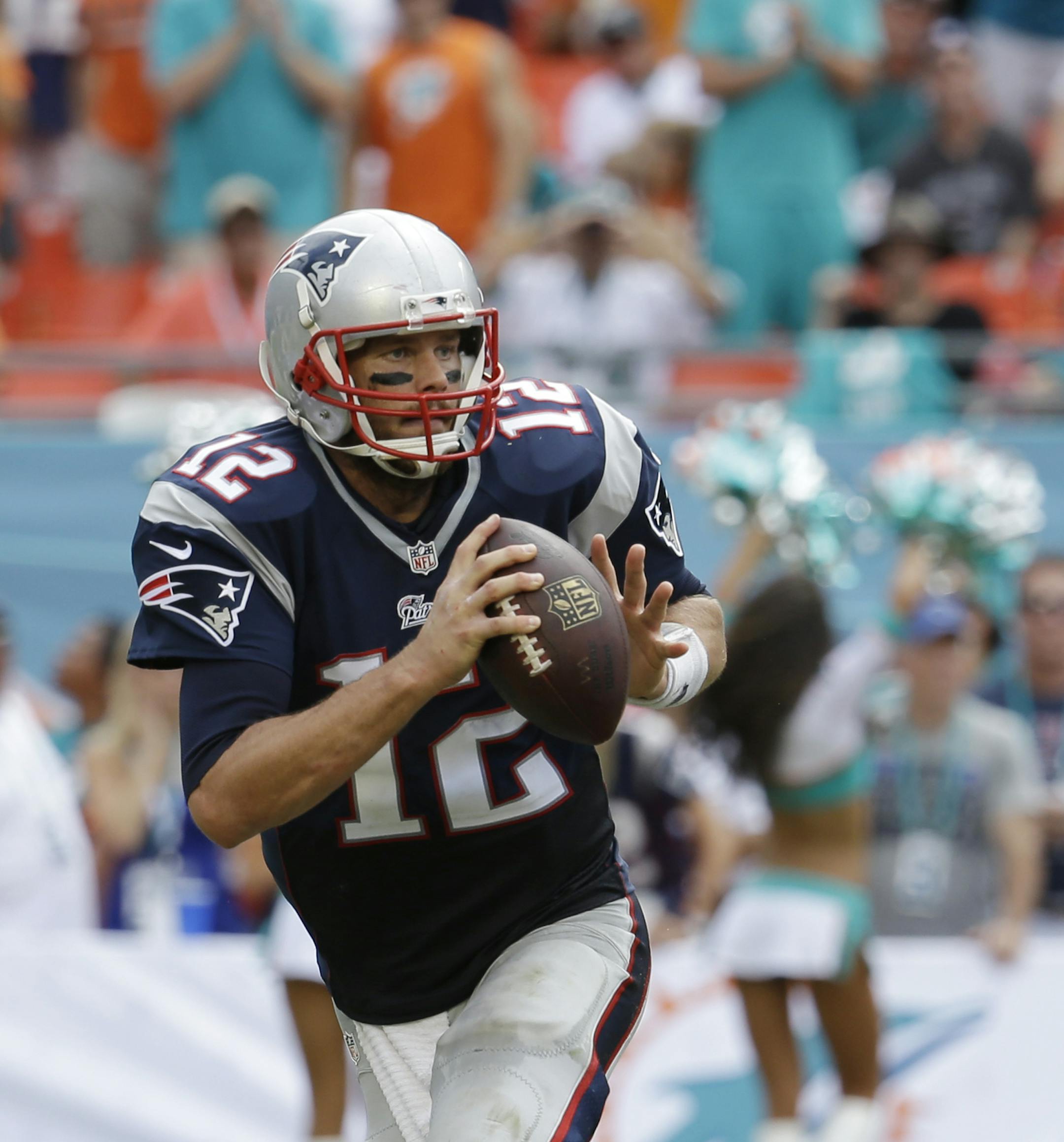 New England Patriots quarterback Tom Brady (12) looks to pass during the second half of an NFL football game against the Miami Dolphins, in Miami Gardens, Fla., Sunday Sept. 7, 2014. (AP Photo/Lynne Sladky)
