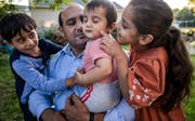 Roman Khan is grateful that his children Yusuf, 5, Hamza, 10 months, and Mina, 6, get to grow up in St. Paul Park, not under Taliban rule.