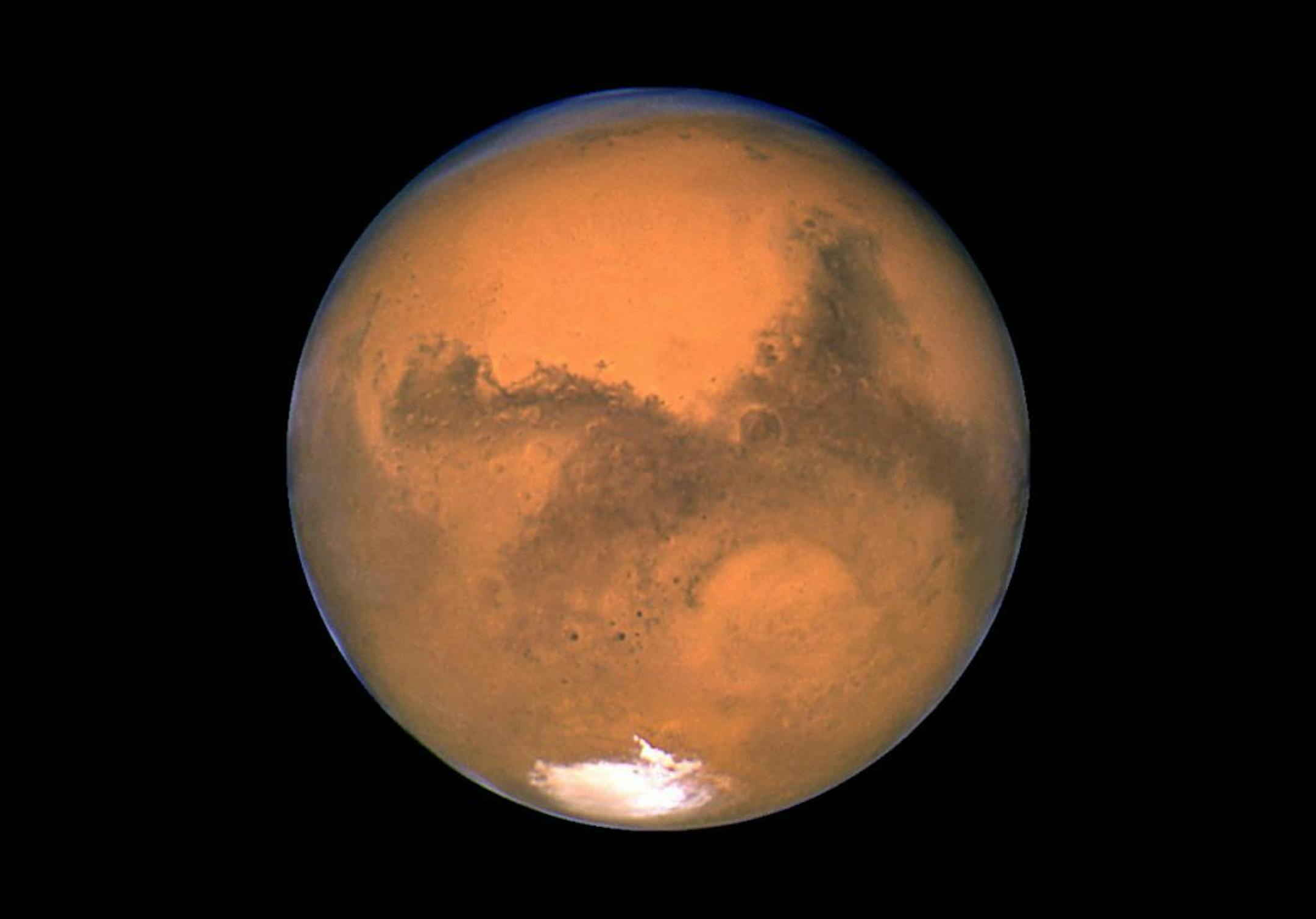 This Aug. 26, 2003 image made available by NASA shows Mars photographed by the Hubble Space Telescope on the planet's closest approach to Earth in 60,000 years. NASA�s robotic rover Curiosity landed safely on Mars late Sunday, Aug. 5, 2012 to begin two years of exploration. The mission cost $2.5 billion. (AP Photo/NASA) ORG XMIT: MIN2013011121161812 ORG XMIT: MIN1305171148540158 ORG XMIT: MIN1410151126210421 ORG XMIT: MIN1510021504350103