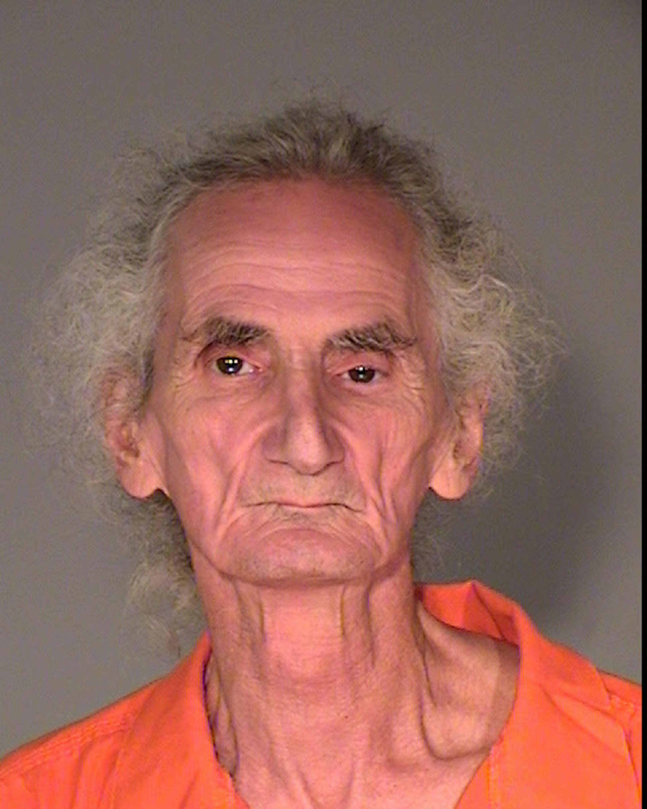 John R. Stanton is charged with moving a dead woman's body from his apartment to a wooded area.