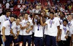 Memphis Grizzlies pose for photographers after defeating the Minnesota Timberwolves in an NBA summer league championship basketball game Monday, July 