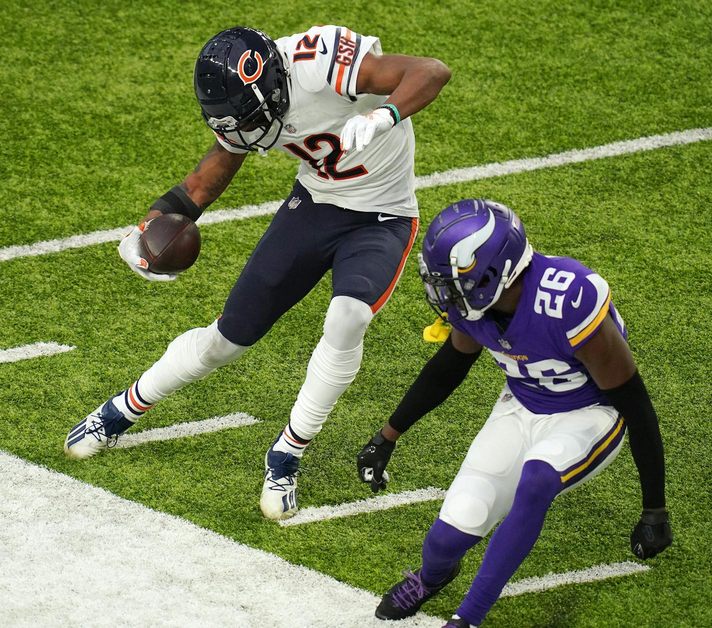 Chicago Bears wide receiver Allen Robinson (12) stopped himself from running out of bounds as Minnesota Vikings defensive back Chris Jones (26) raced to defend in the fourth quarter. The Minnesota Vikings played the Chicago Bears in their last home game of the season, sans fans to comply with state regulations meant to slow the spread of COVID-19, Sunday, Dec. 20, 2020 at U.S. Bank Stadium in Minneapolis. (Anthony Souffle/Star Tribune/TNS) ORG XMIT: 3834416W