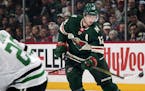 The Minnesota Wild's Eric Staal (12) tries to get control of the puck in the first period against the Dallas Stars on Wednesday, Dec. 27, 2017, at the