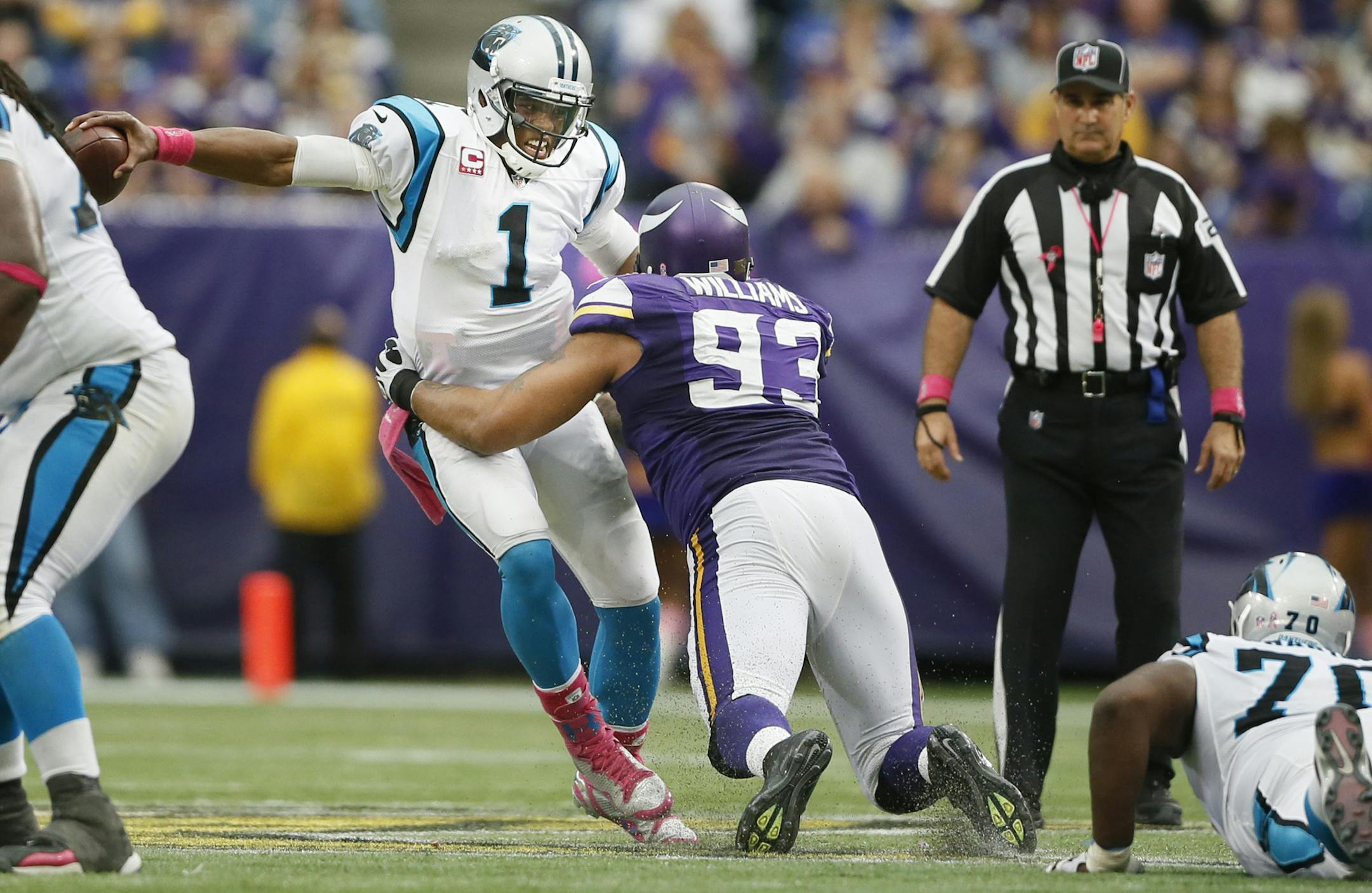 Carolina quarterback Cam Newton sidestepped a sack attempt by Vikings defensive tackle Kevin Williams. The Vikings had made a game plan to swarm Newton.