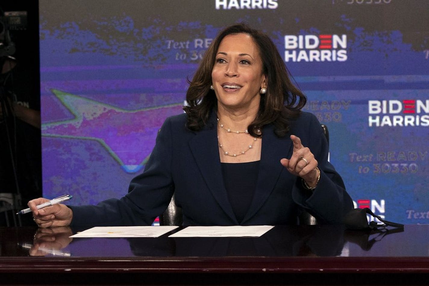 Sen. Kamala Harris (D-Calif.), Joe Biden's running mate, signs required documents for receiving the Democratic nomination for vice president of the United States, in Wilmington, Del., on Friday, Aug. 14, 2020.