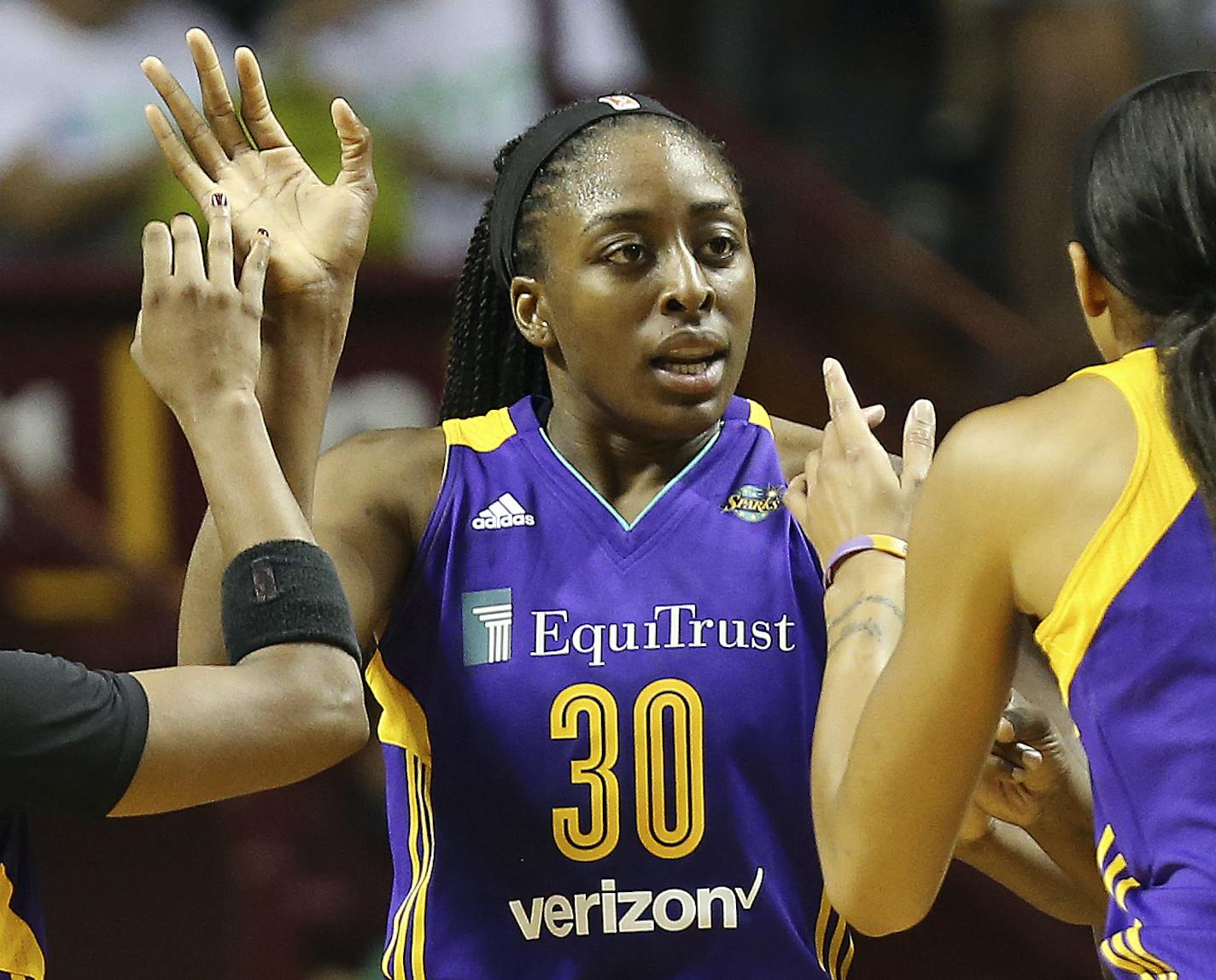 Los Angeles Sparks forward Nneka Ogwumike (30) high fives teammates guard Odyssey Sims, left, and center Candace Parker, right, in the first half of Game 1 in the WNBA basketball final Sunday, Sept. 24, 2017, in Minneapolis. (AP Photo/Stacy Bengs) ORG XMIT: MIN2017092521254847