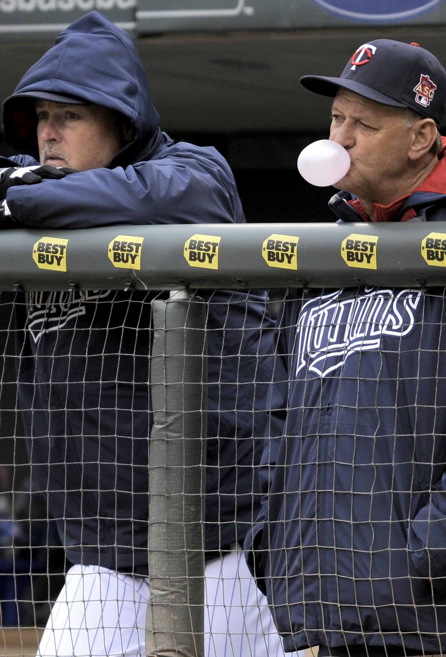 Minnesota Twins coaches Tom Brunansky, left and Terry Steinbach, right, during a baseball game against the Kansas City Royals in Minneapolis, Sunday, April 13, 2014. (AP Photo/Tom Olmscheid) ORG XMIT: NYOTK ORG XMIT: MIN1405031714494797