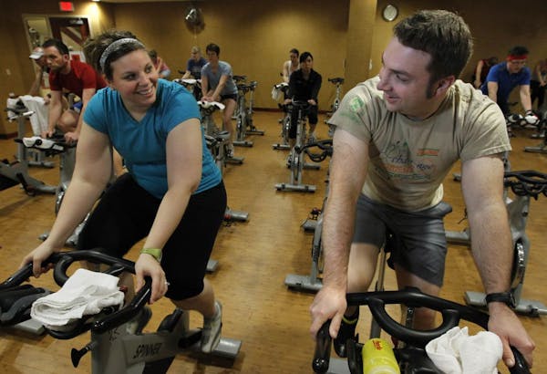Couples who work out together; Ann Freeman, 29, and Jay Freeman, 27 at the Lifetime fitness Studio spin class last week.