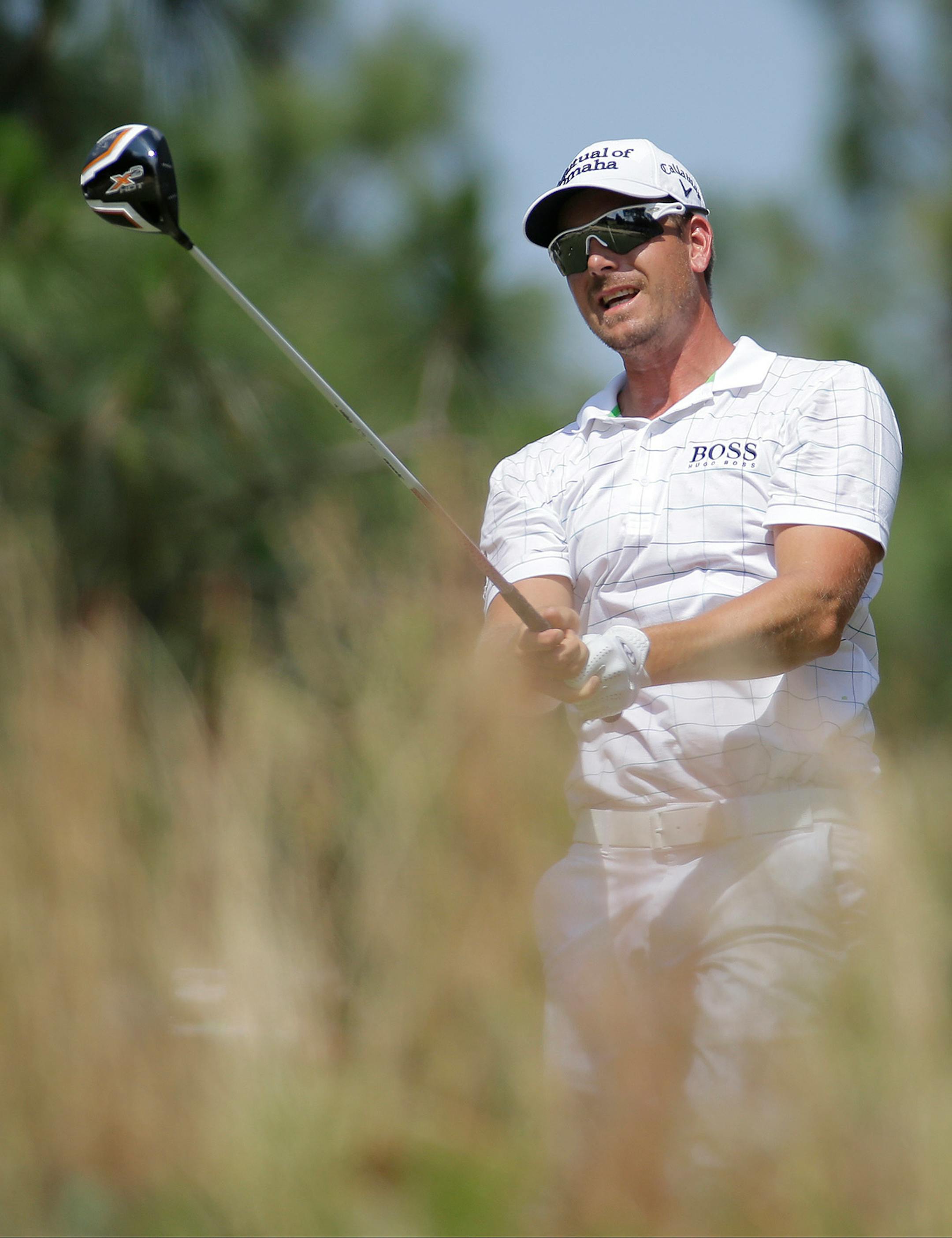 Henrik Stenson, of Sweden, watches his tee shot on the fifth hole during the third round of the U.S. Open golf tournament in Pinehurst, N.C., Saturday, June 14, 2014.