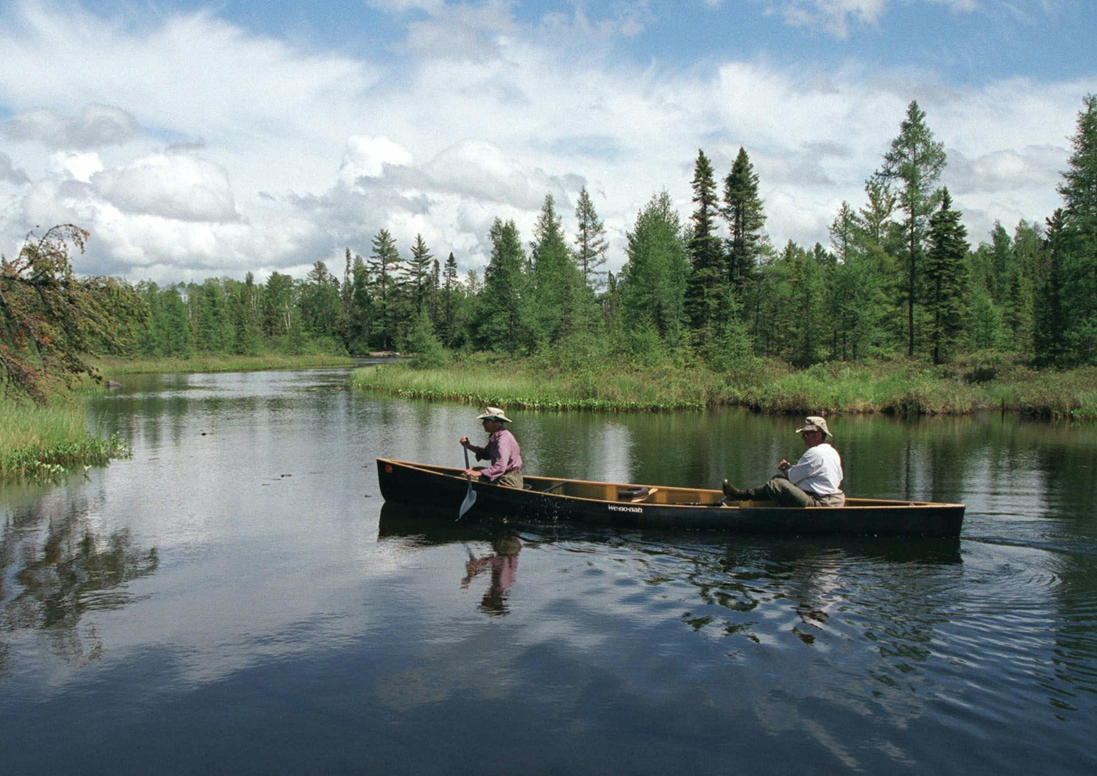 Bert and Diane Heep, a couple from Ely, Minn., in thier 50&#x221a;&#x2260;s, glide toward a shallow portage during a day trip on their campsite on Thomas Lake to Insula Lake in the Boundary Waters Canoe Area Wilderness in June, 2000. The Ely couple are in the middle of a 4 1/2 month trek in the BWCAW and adjacent Quetico Provincial Park that began in mid-May and will end in October. (AP Photo/Star Tribune, Tom Sweeney) ORG XMIT: MIN2013060513220364 ORG XMIT: MIN1308301137270044 ORG XMIT: MIN1405