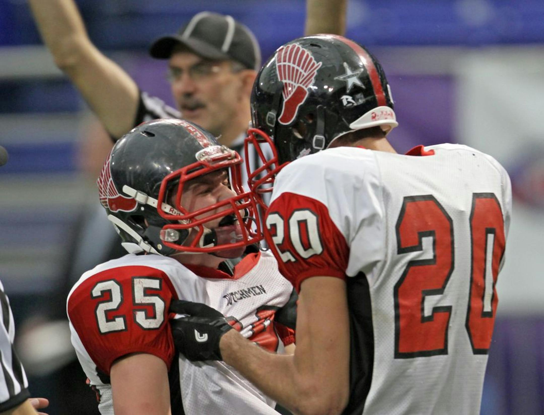 Wheaton/Herman-Norcross vs Edgerton/Ellsworth, 9-man football championship at the Dome, 11/25/11. (left to right) Edgerton's Blake Jouwstra celebrated his 4th quarter touchdown catch with Casey Schilling.