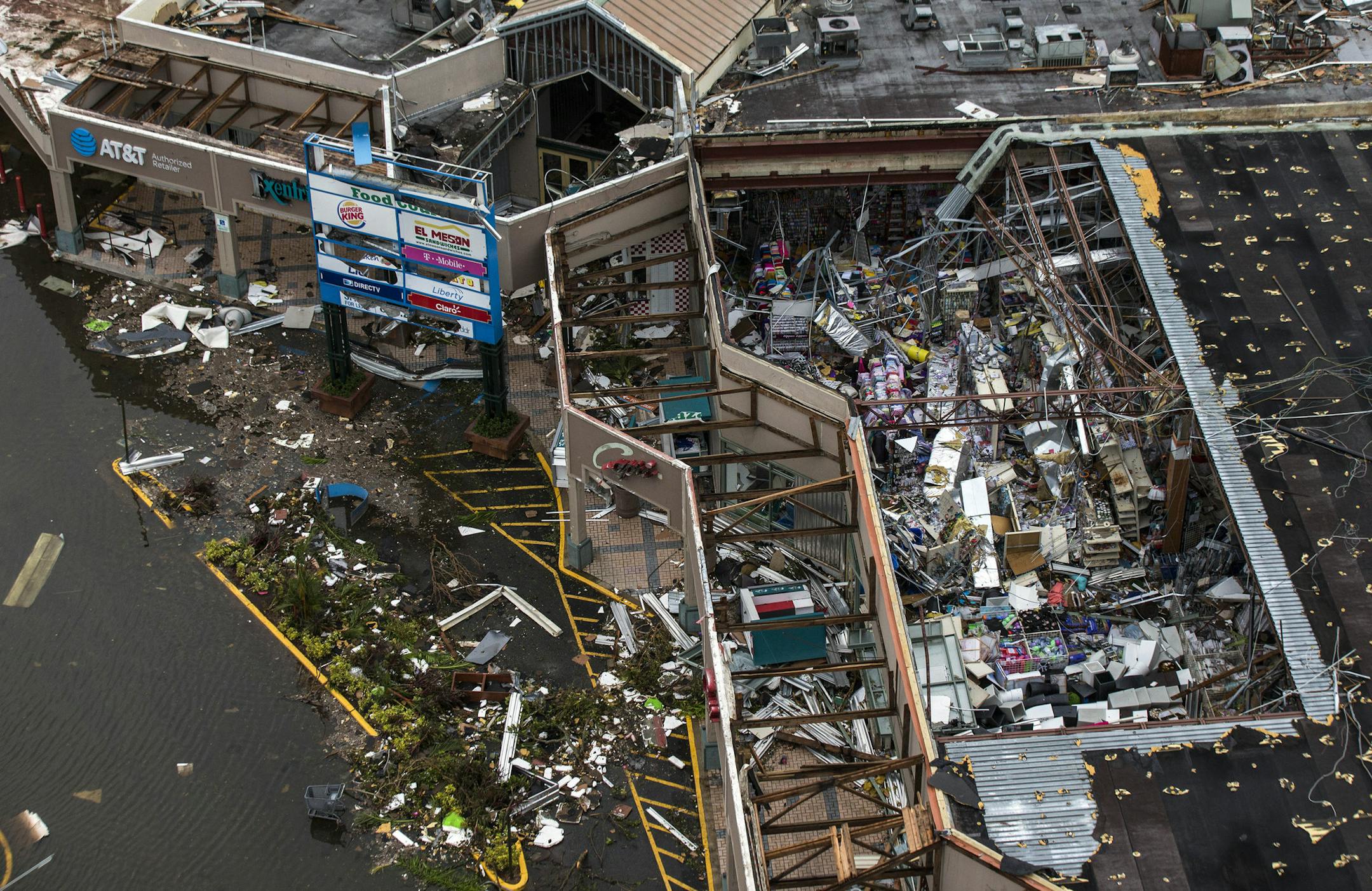 Debris covers the interior of a building with a destroyed roof at the Palma Real Shopping Center in Humacao on Sept. 22, two days after Hurricane Maria devastated large areas of Puerto Rico. MUST CREDIT: Dennis M. Rivera Pichardo for The Washington Post.