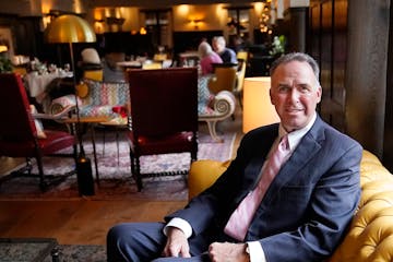 Joe Puishys, chairman of the Minneapolis Club board, sits in the downtown club’s dining room.