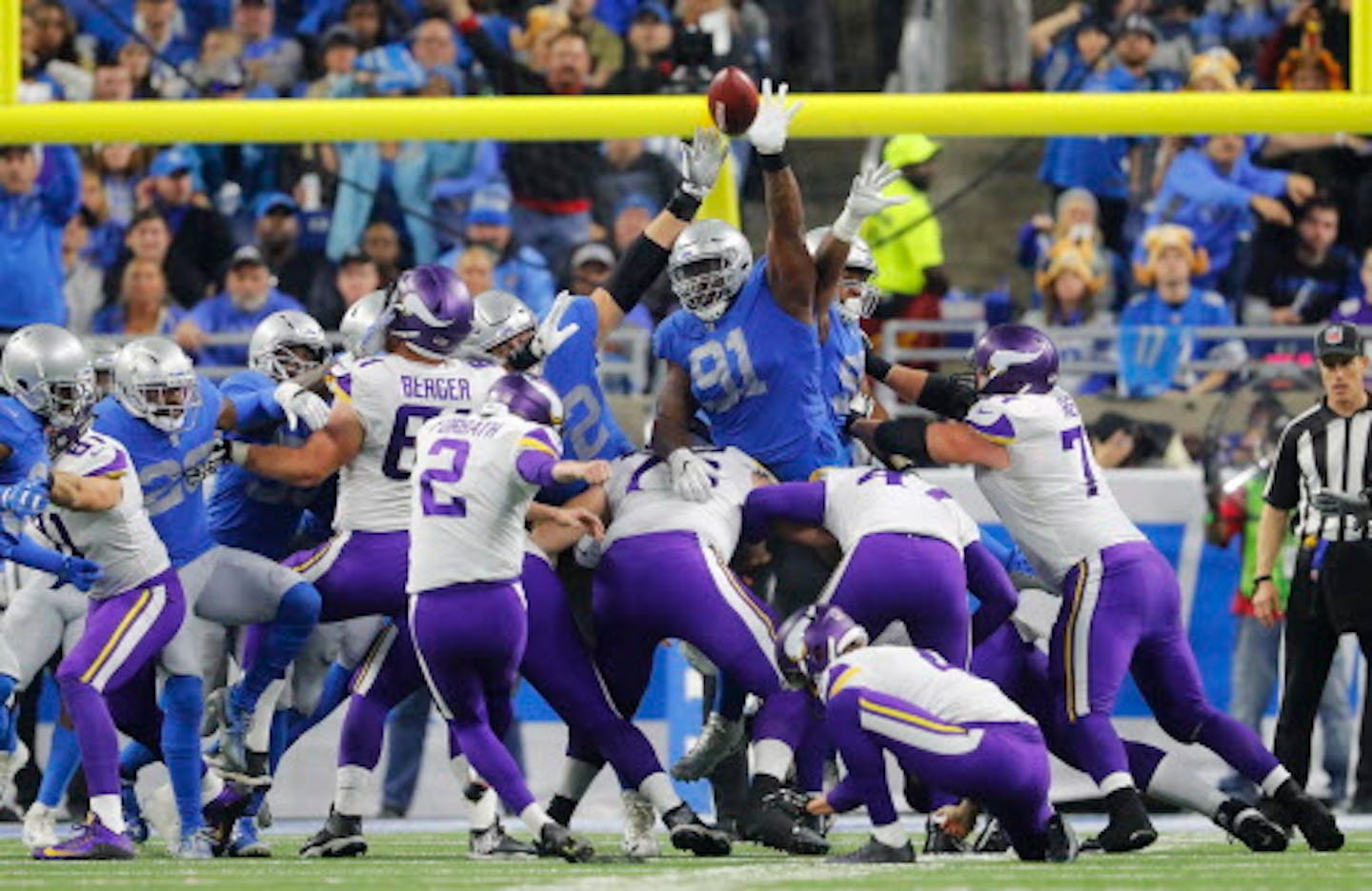 Detroit Lions defensive tackle A'Shawn Robinson (91) blocks a field goal attempt by Minnesota Vikings kicker Kai Forbath (2) during the first half of an NFL football game, Thursday, Nov. 23, 2017, in Detroit. (AP Photo/Paul Sancya)