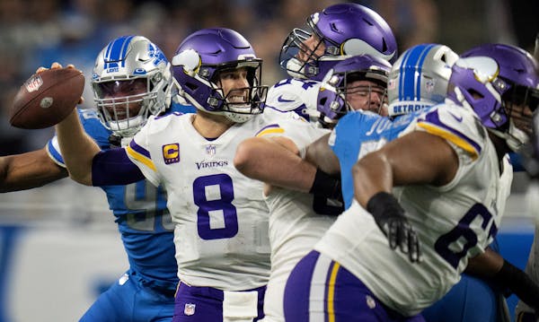 Vikings quarterback Kirk Cousins played behind an offensive line missing two starters against the Lions on Sunday.