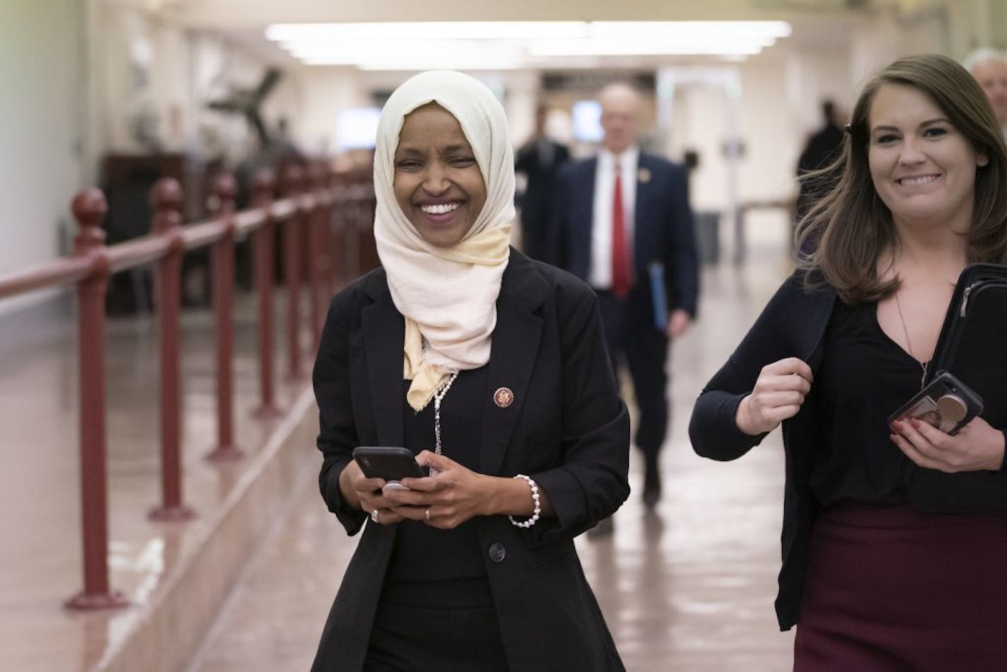 Rep. Ilhan Omar, D-Minn., walked to the chamber as the U.S. House was preparing to vote on the resolution Thursday.