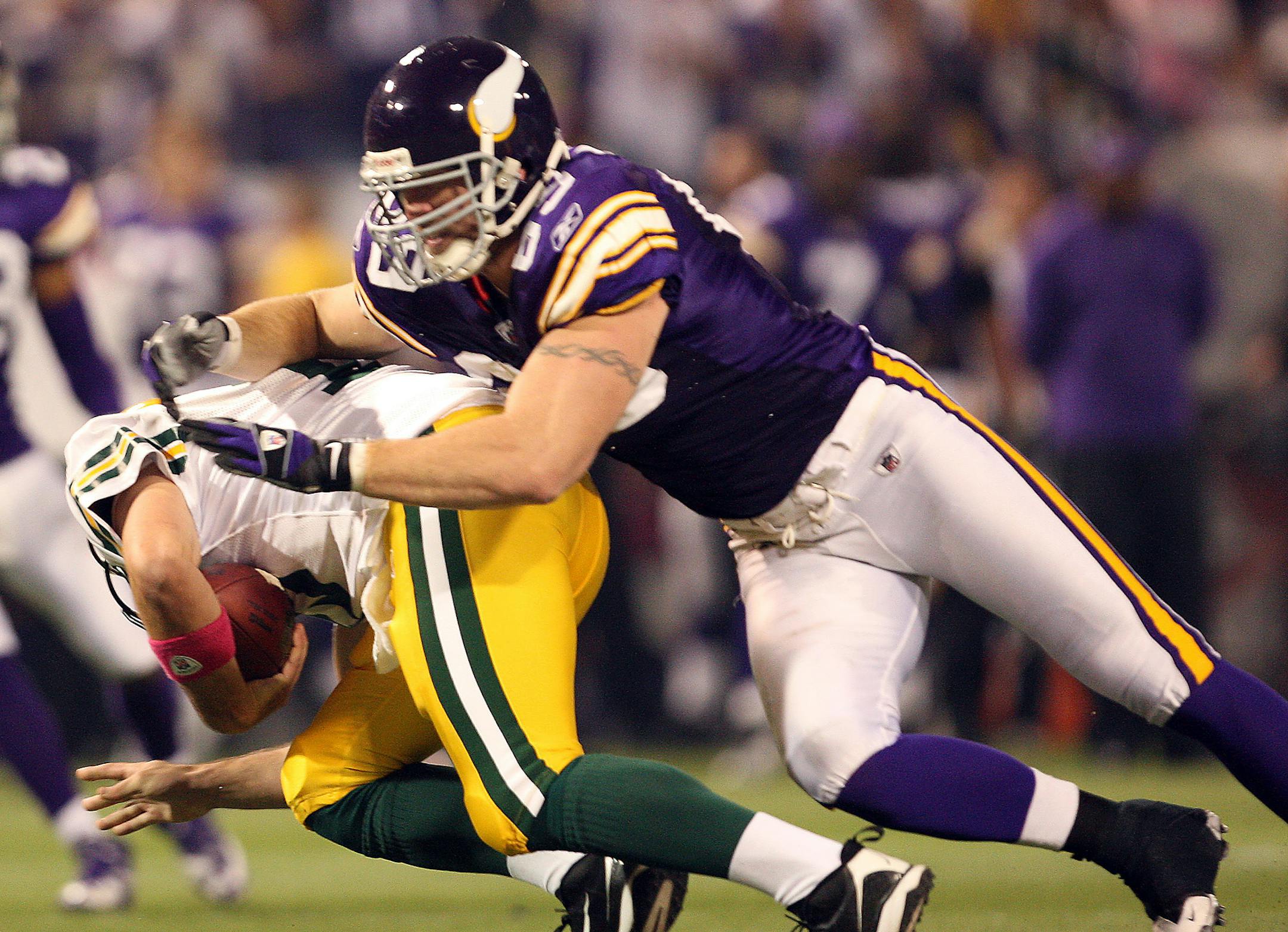 CARLOS GONZALEZ • cgonzalez@startribune.com October 5, 2009 – Minneapolis, MN – The Metrodome – NFL – Monday Night Football – Minnesota Vikings vs, Green Bay Packers ] Green Bay quarterback Aaron Rodgers. (12) was sacked by Jared Allen (69) in the third quarter. Minnesota beat Green Bay by a final score of 30-23. ORG XMIT: MIN2013102523242138