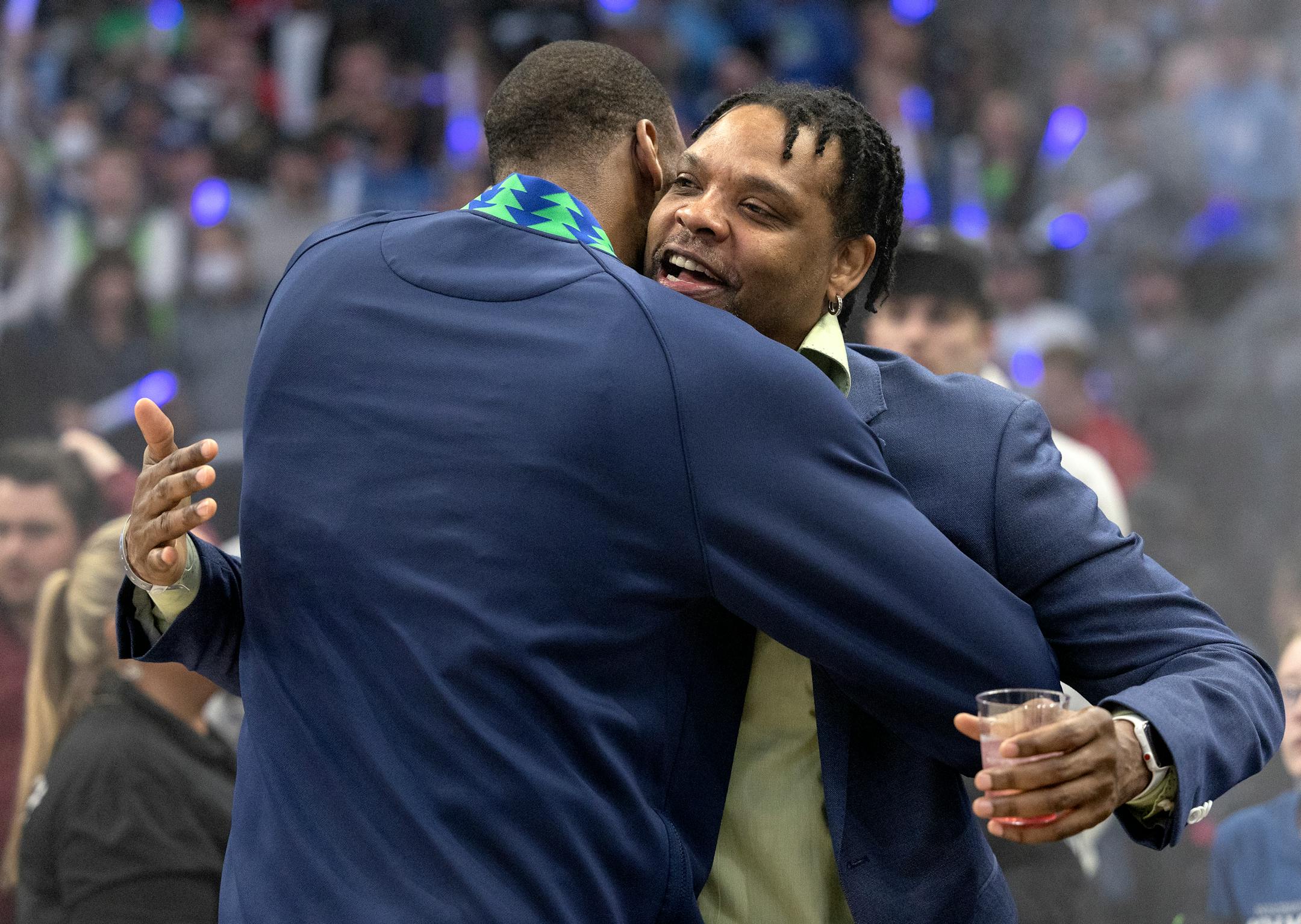 Latrell Sprewell greeted Greg Monroe (55) of the Minnesota Timberwolves before game 6 of the playoffs round one.